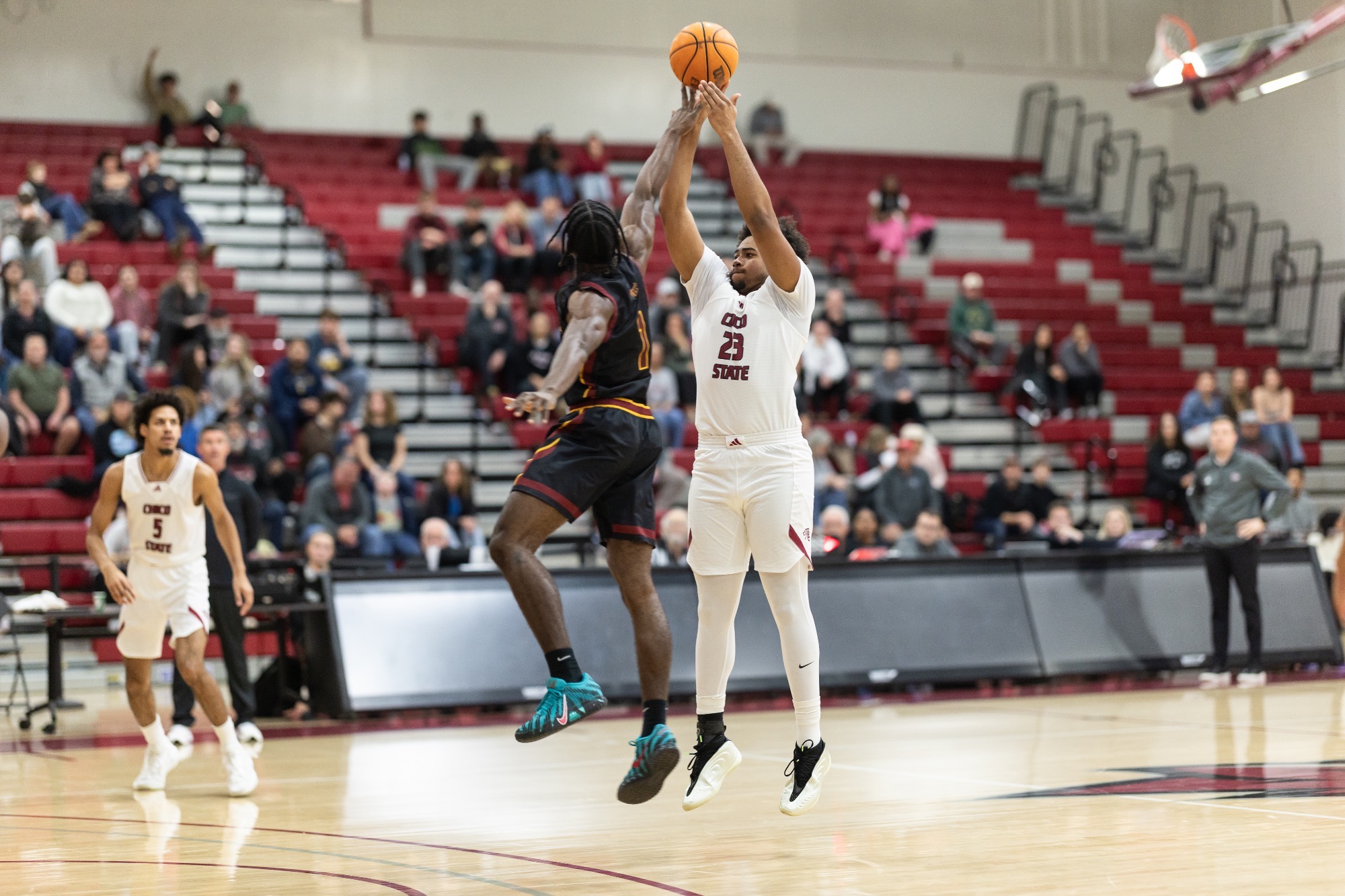 Cortevious Taylor shoots a three over a CSUDH player at home