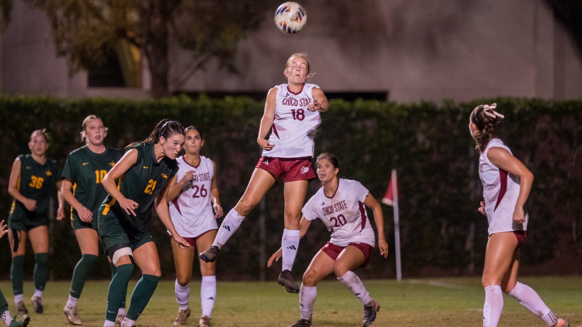 Chico State Wildcats’ #18 Macyn Stewart (center) goes up for a header against Cal Poly Pomona Broncos in the second half of their Women's Soccer (WSOC) game on Friday, October 2, 2026 in Chico, Calif.(Jason Halley/University Photographer/Chico State)