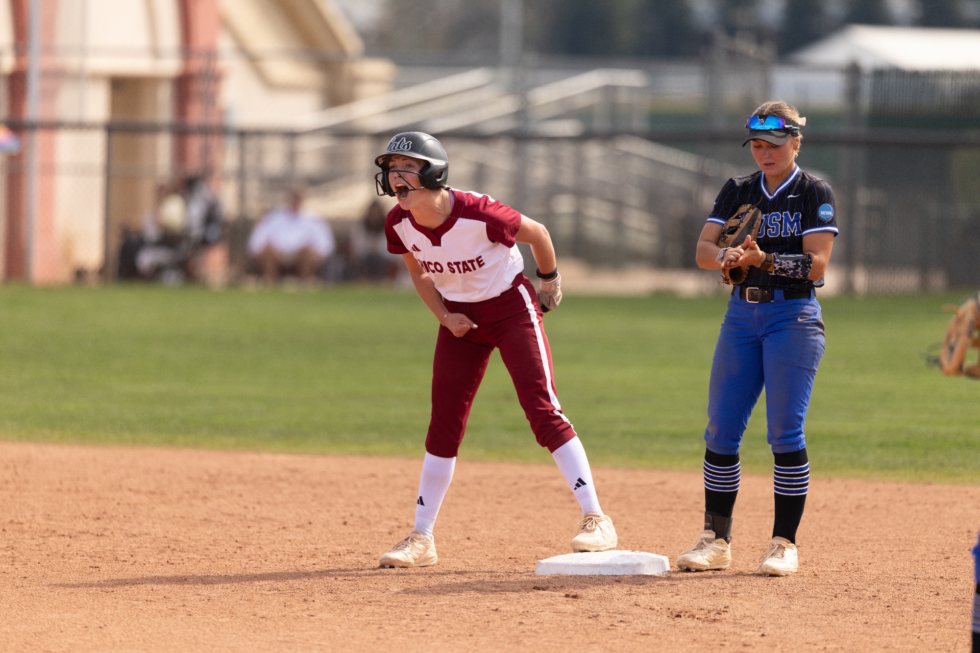 Brianna Swihart excitedly looking at her dugout after scoring the sole run vs San Marcos