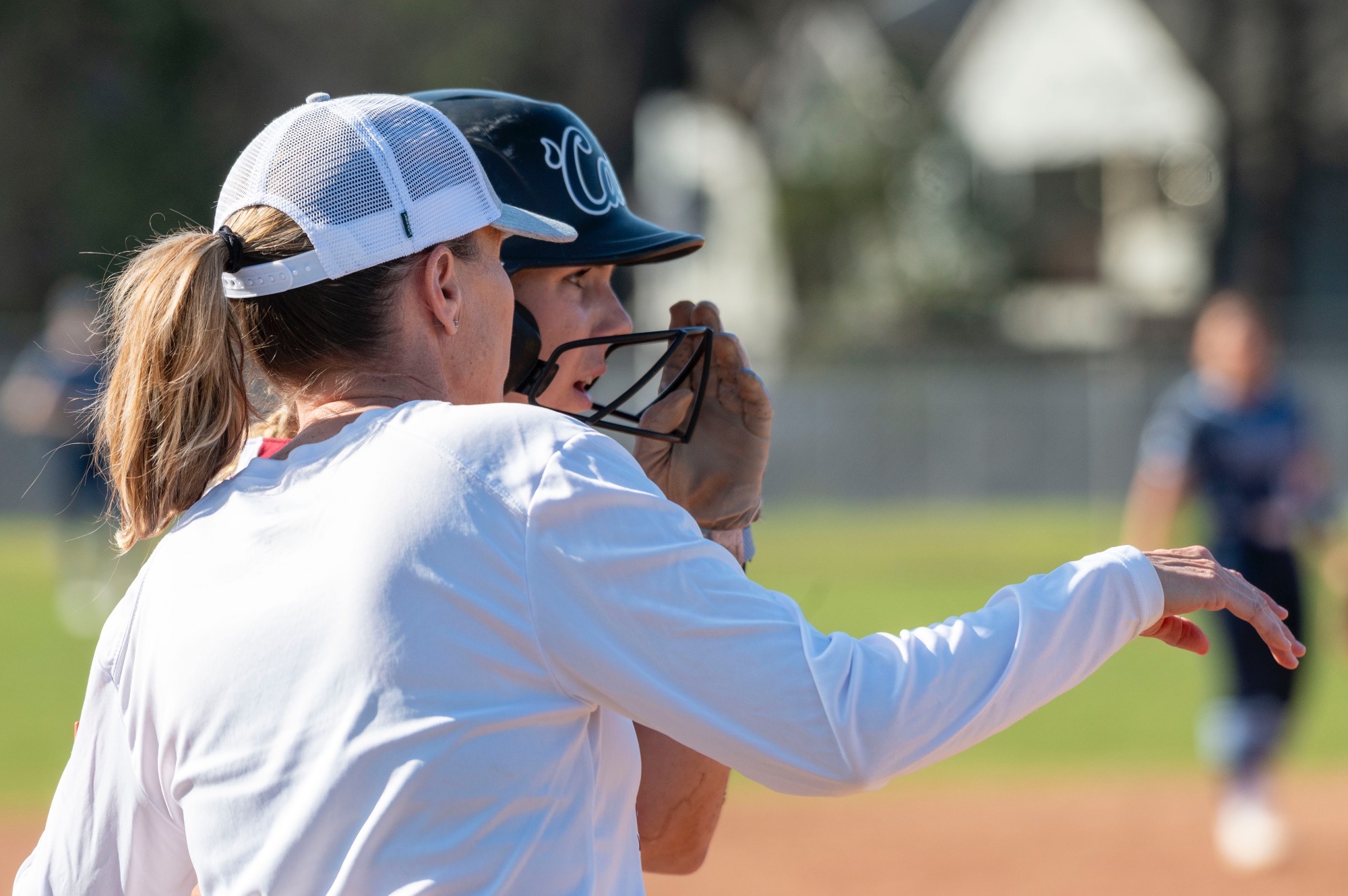 Angel Shamblin talking to a player during a timeout 
