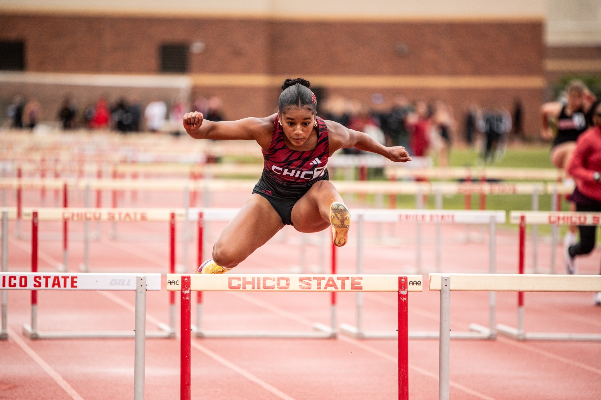 Bella Morales hurdling at the Chico Invite 2026