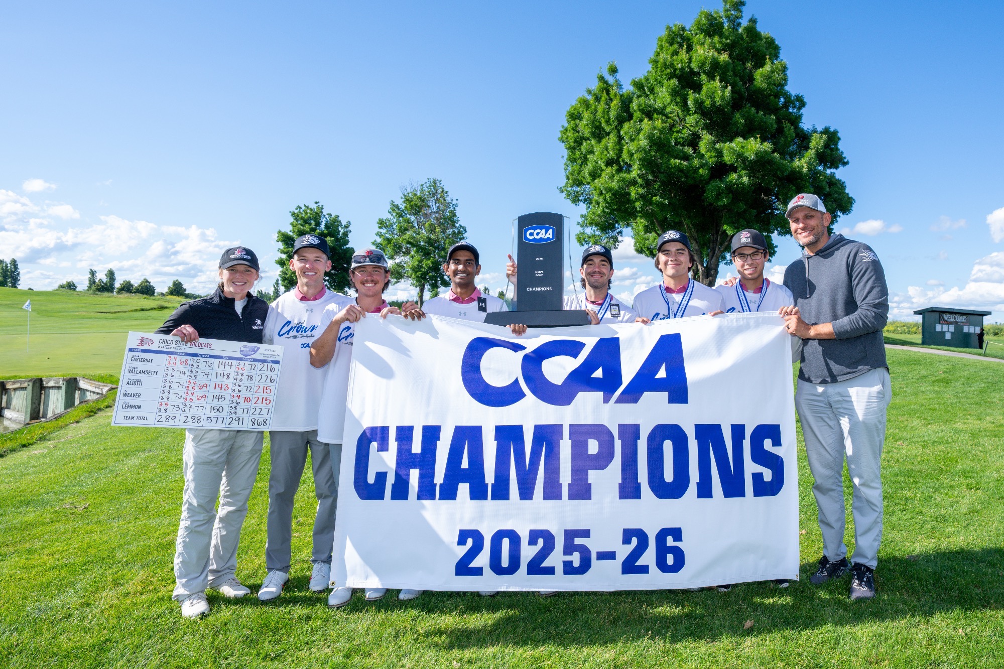 2026 Chico State men's golf and coaches posing for a picture with the CCAA men's golf trophy in Stockton at The Reserves at Spanos Park
