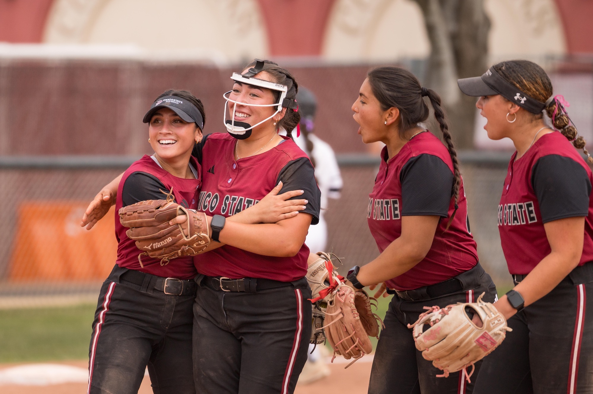 Italia Abrenica celebrates a win over East bay with senior pitcher Amelie Valdez in shutout win at home