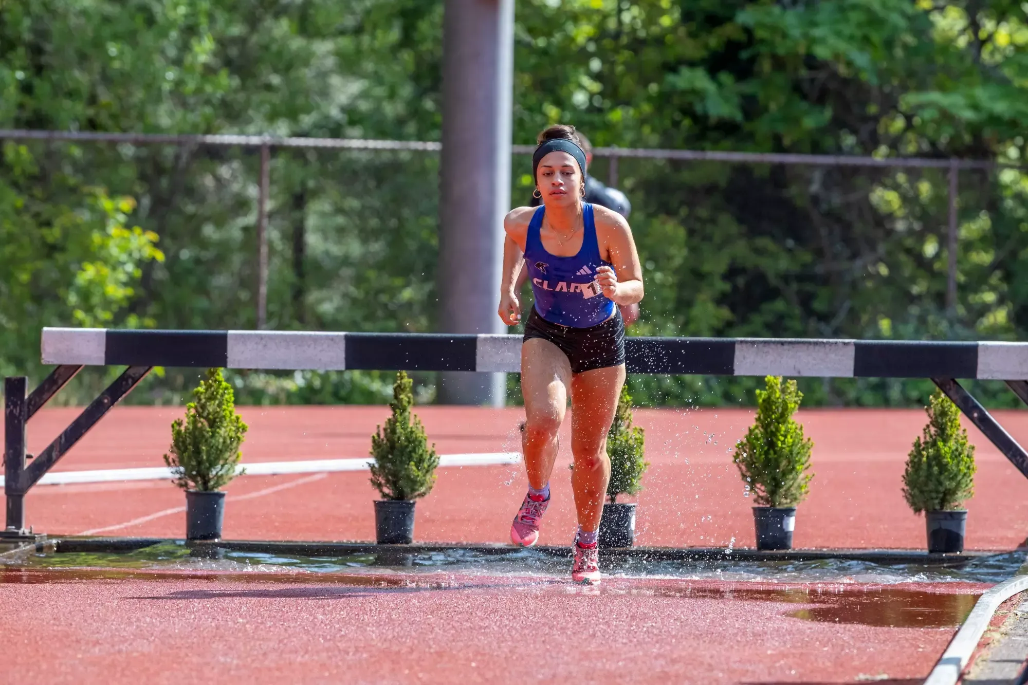 Mariposa Perez clearing the obstacle in the steeple chase