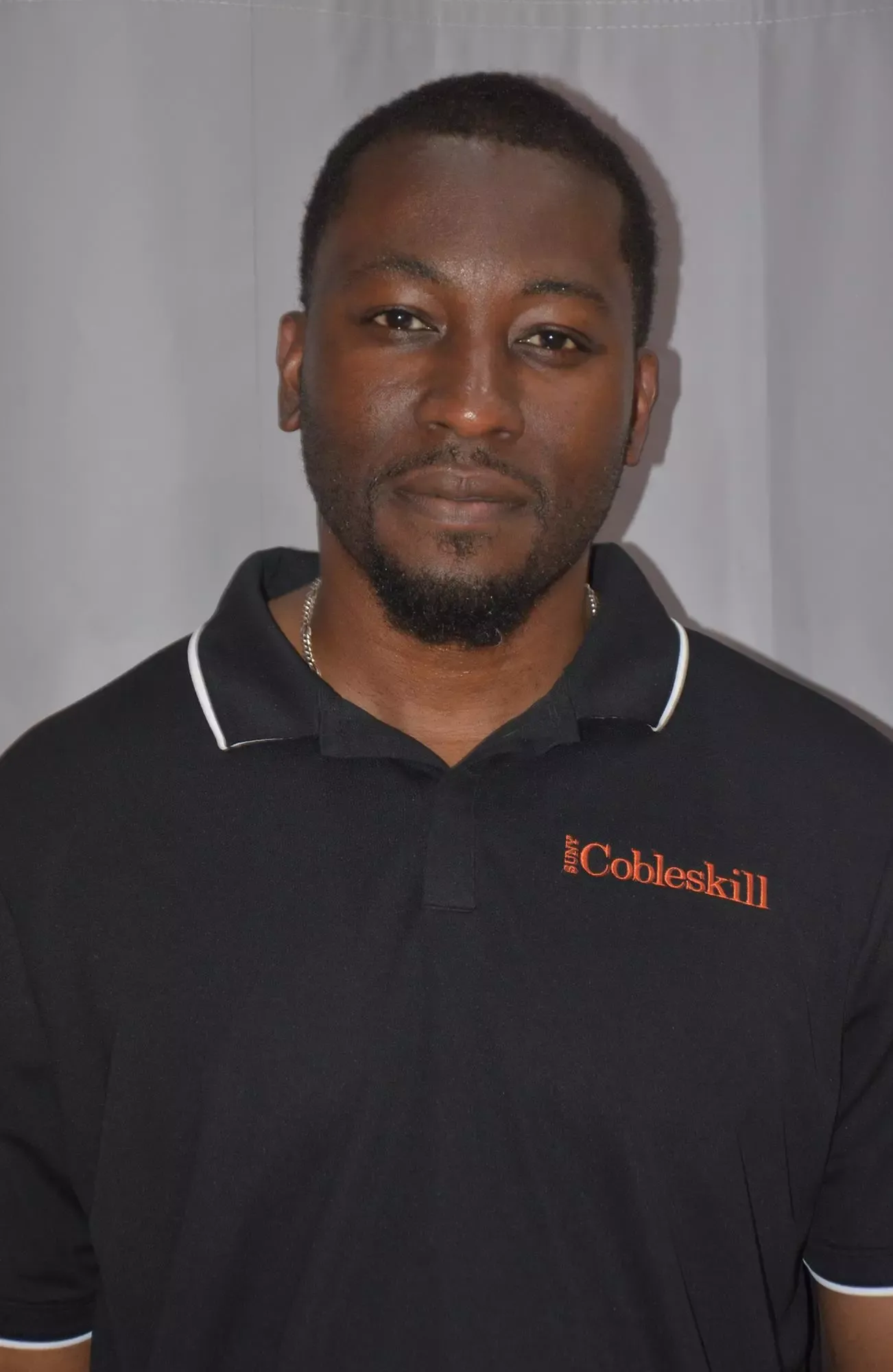Headshot of Head Women's Soccer Coach Chuckwuma Asala