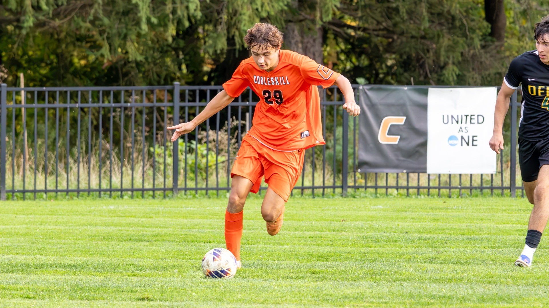 Cobleskill mens soccer Michael Neaton dribbling against Delhi