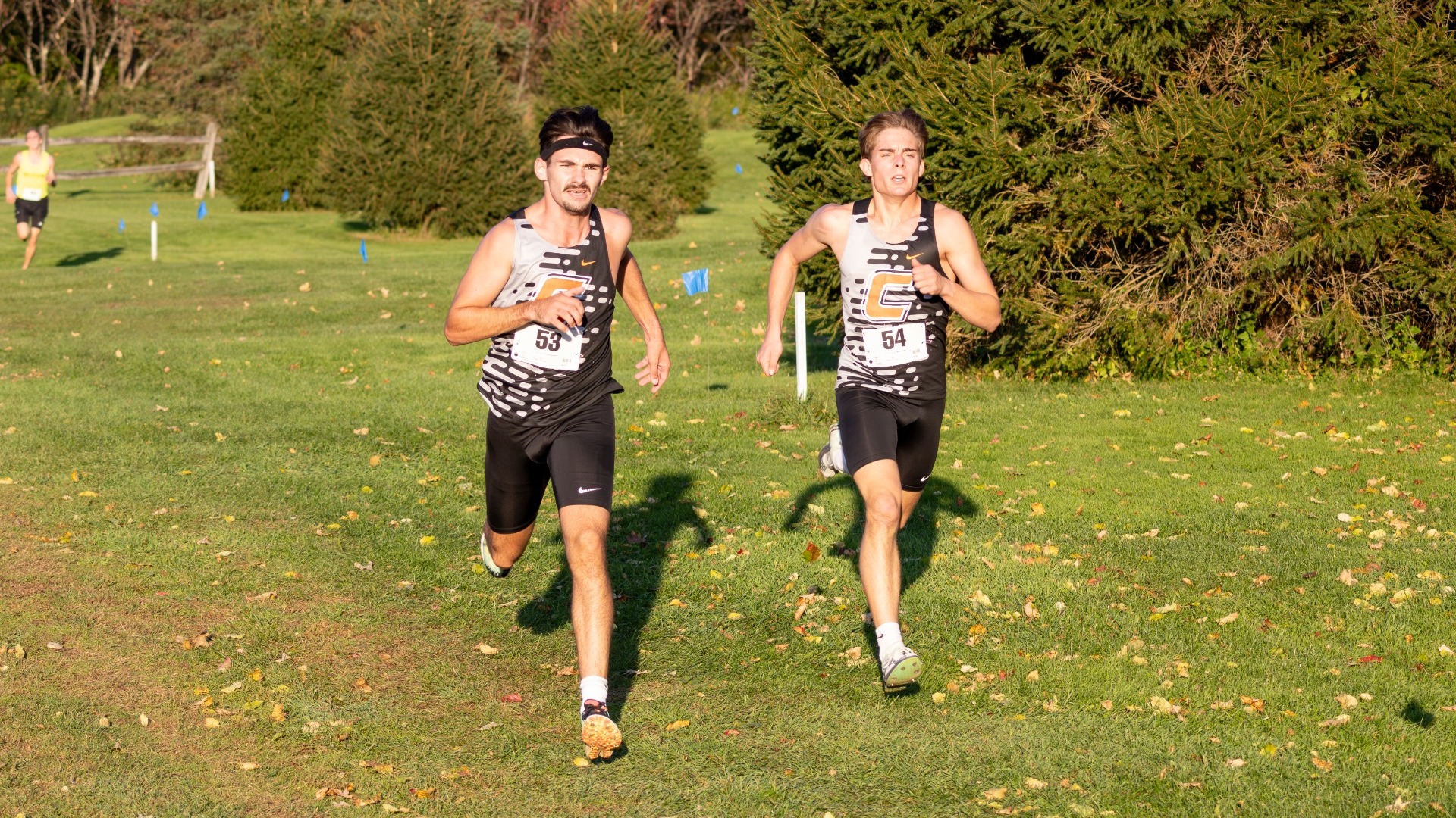 Cobleskill mens cross country runners racing to the finish line 