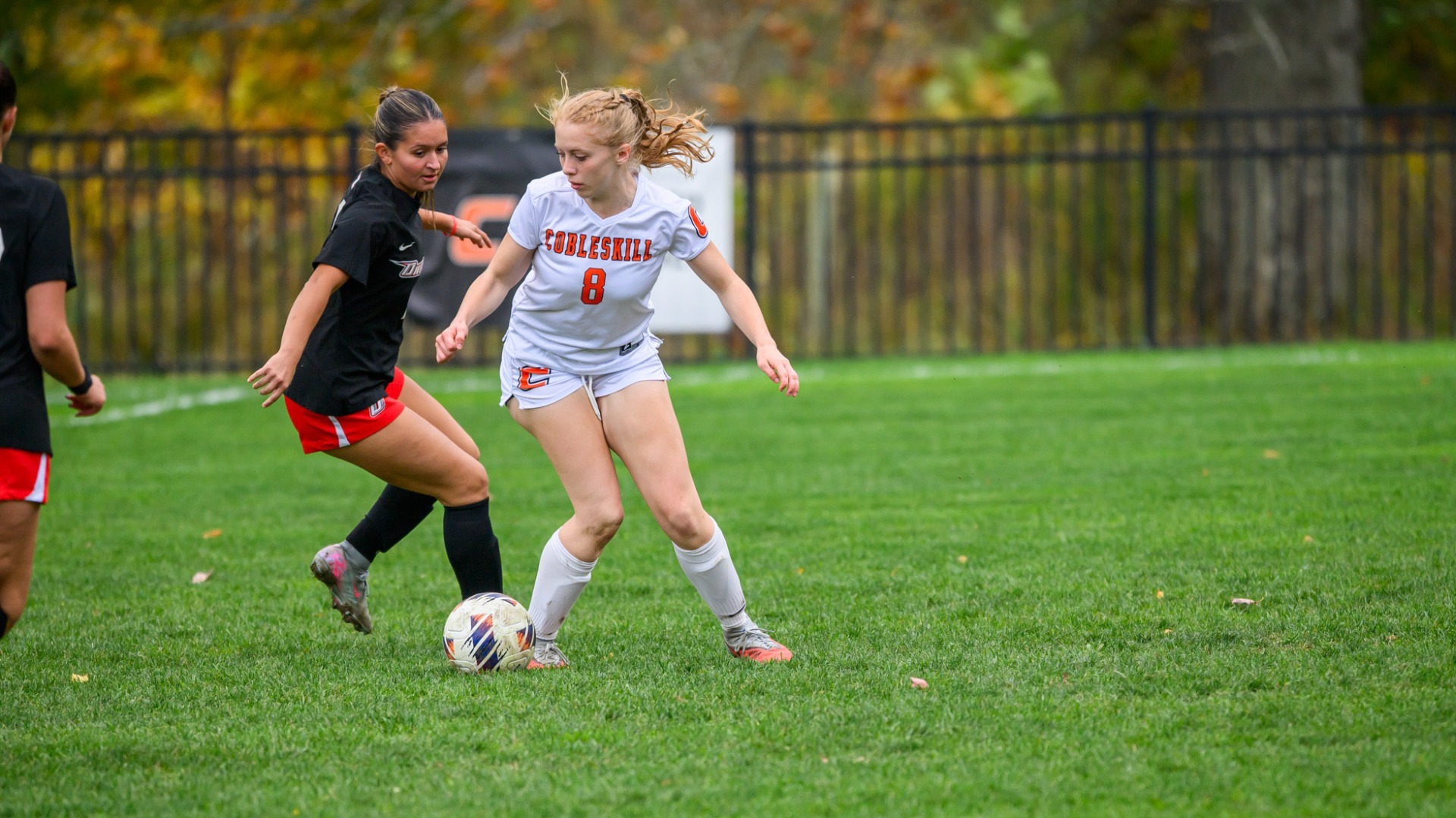 Briana Farrell Battles At Midfield For Possession