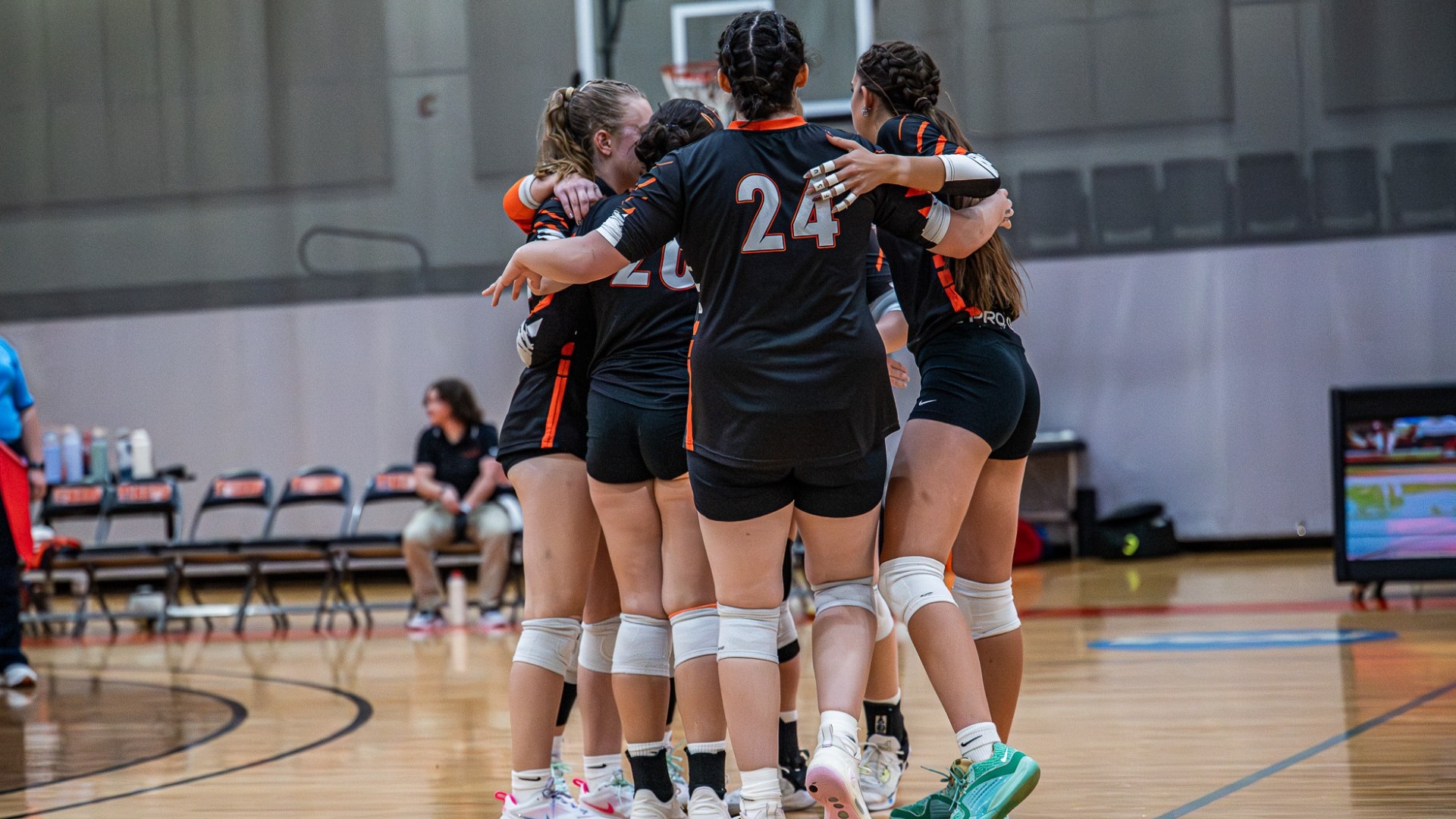 Cobleskill women's volleyball team huddle after a point