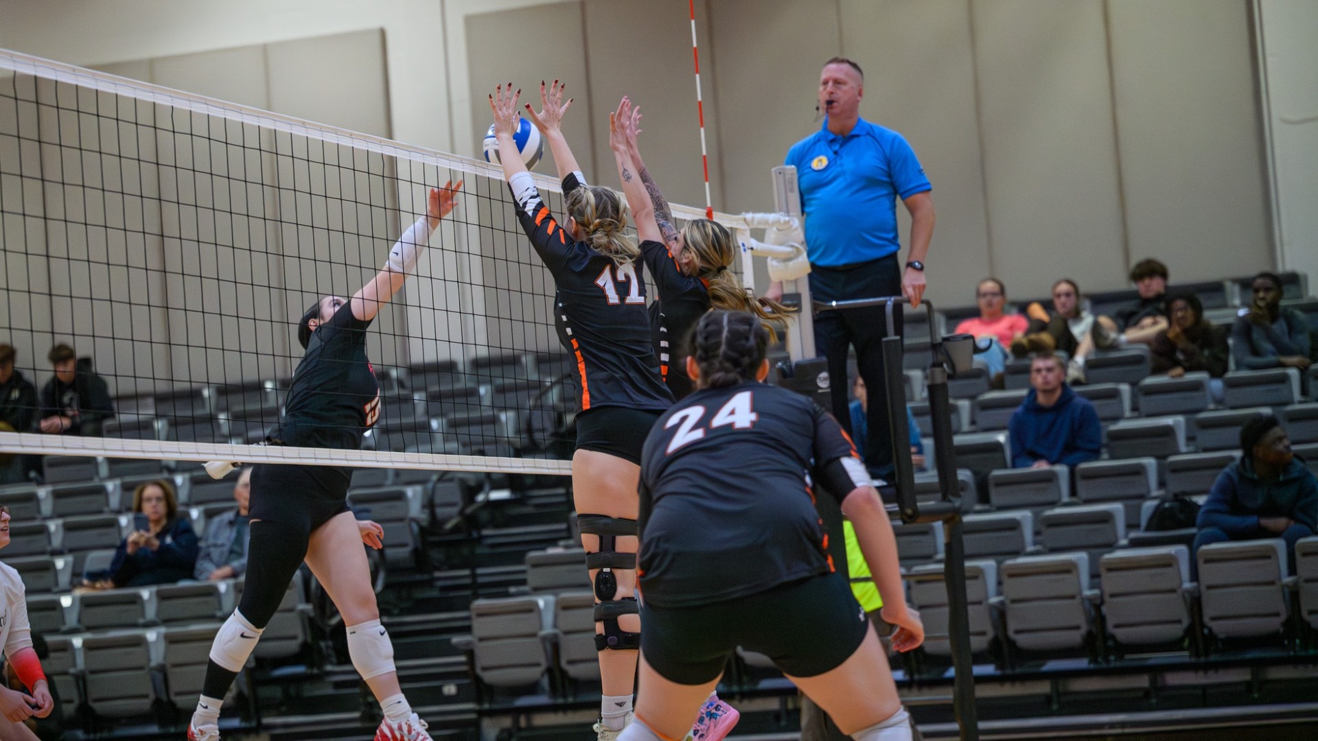Cobleskill women's volleyball Ashley Wright going for a block at the net