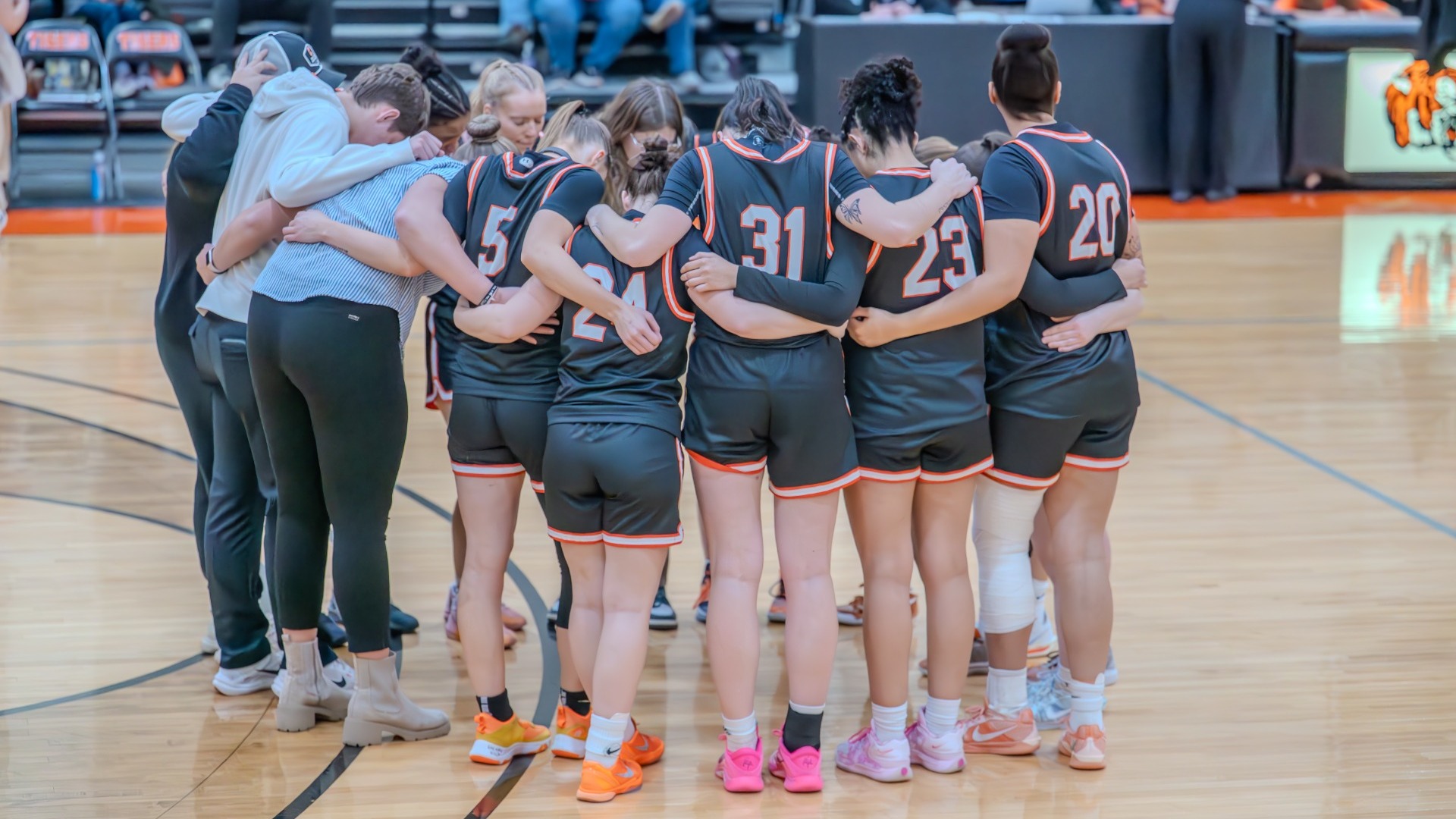 Cobleskill womens basketball team huddle before the game