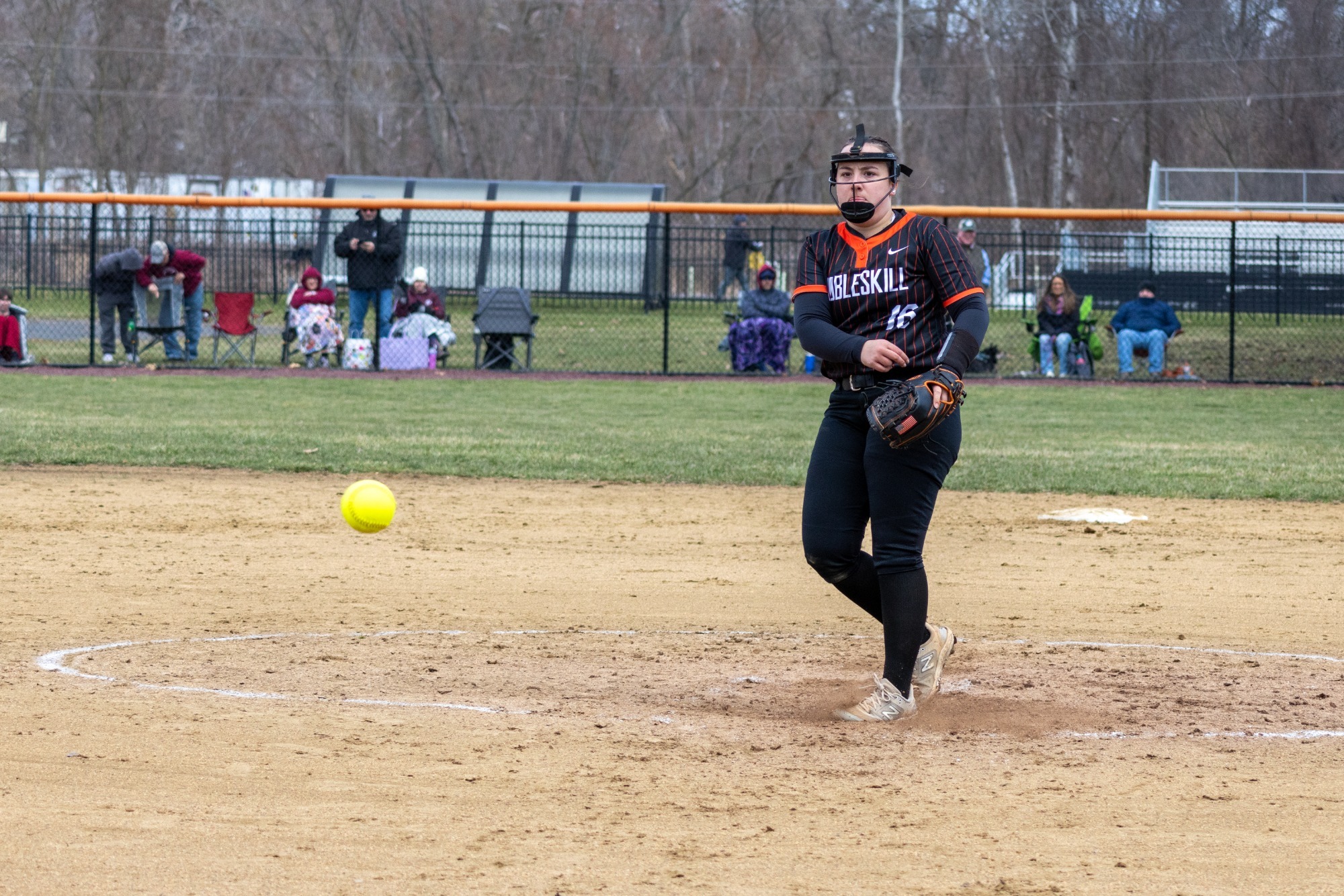 Sam Lawton delivering a pitch against SUNY Potsdam
