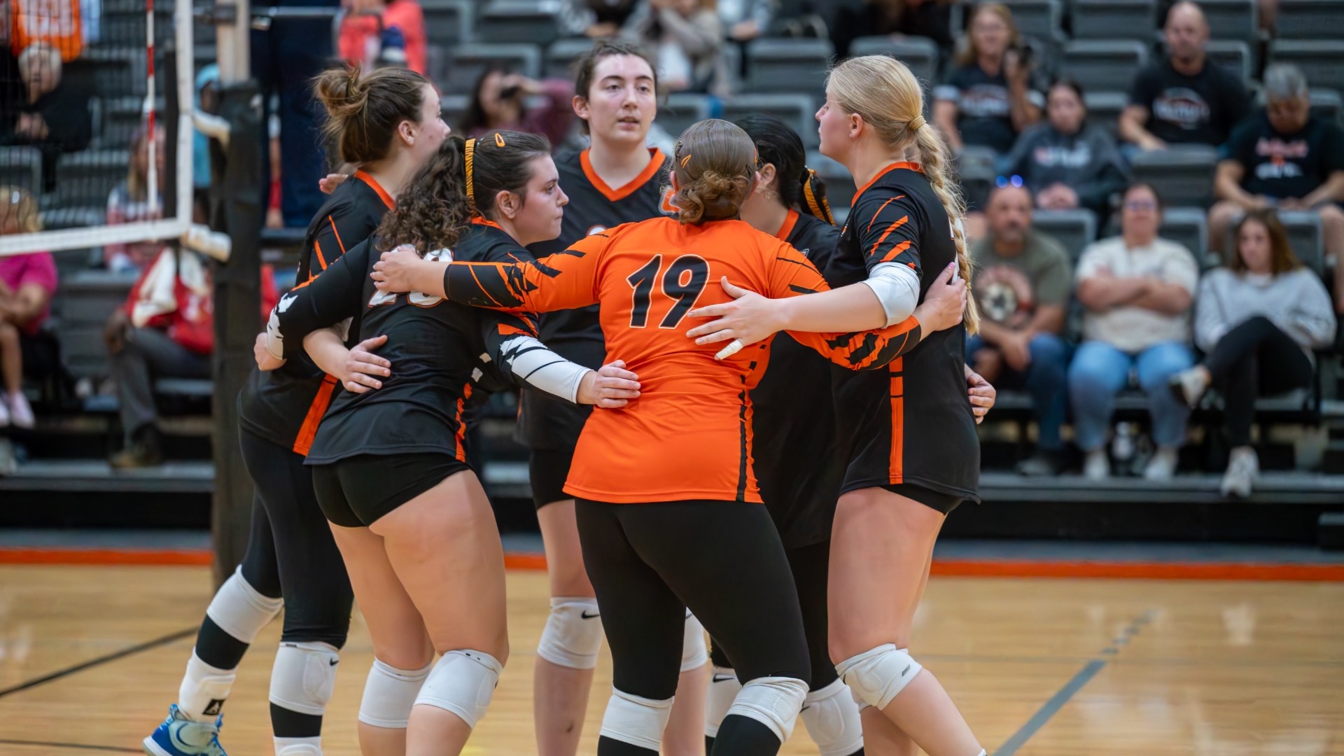2025 Women's Volleyball Huddle after a point