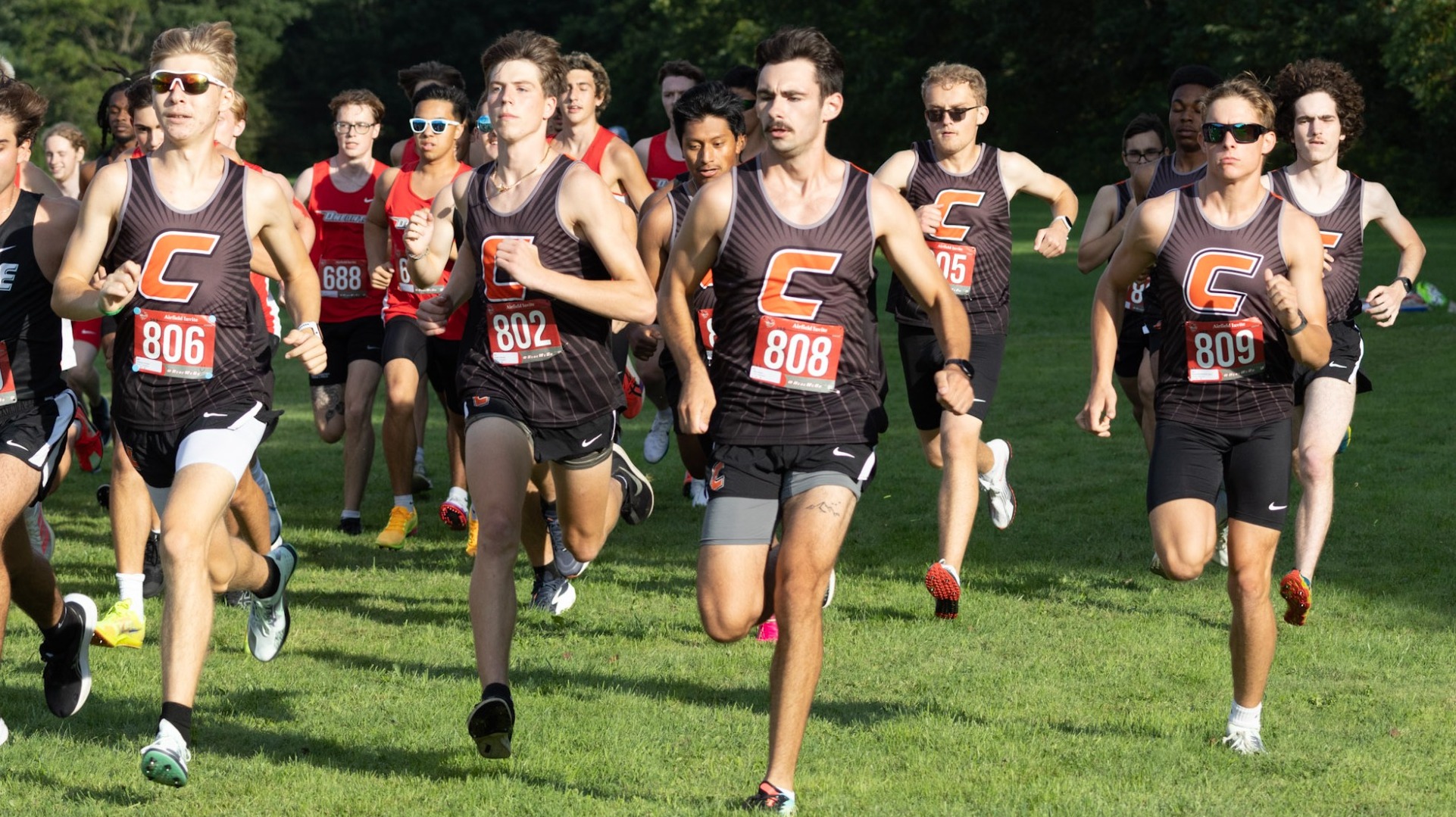 Men's Cross Country Team Taking off at the Start of a 5K