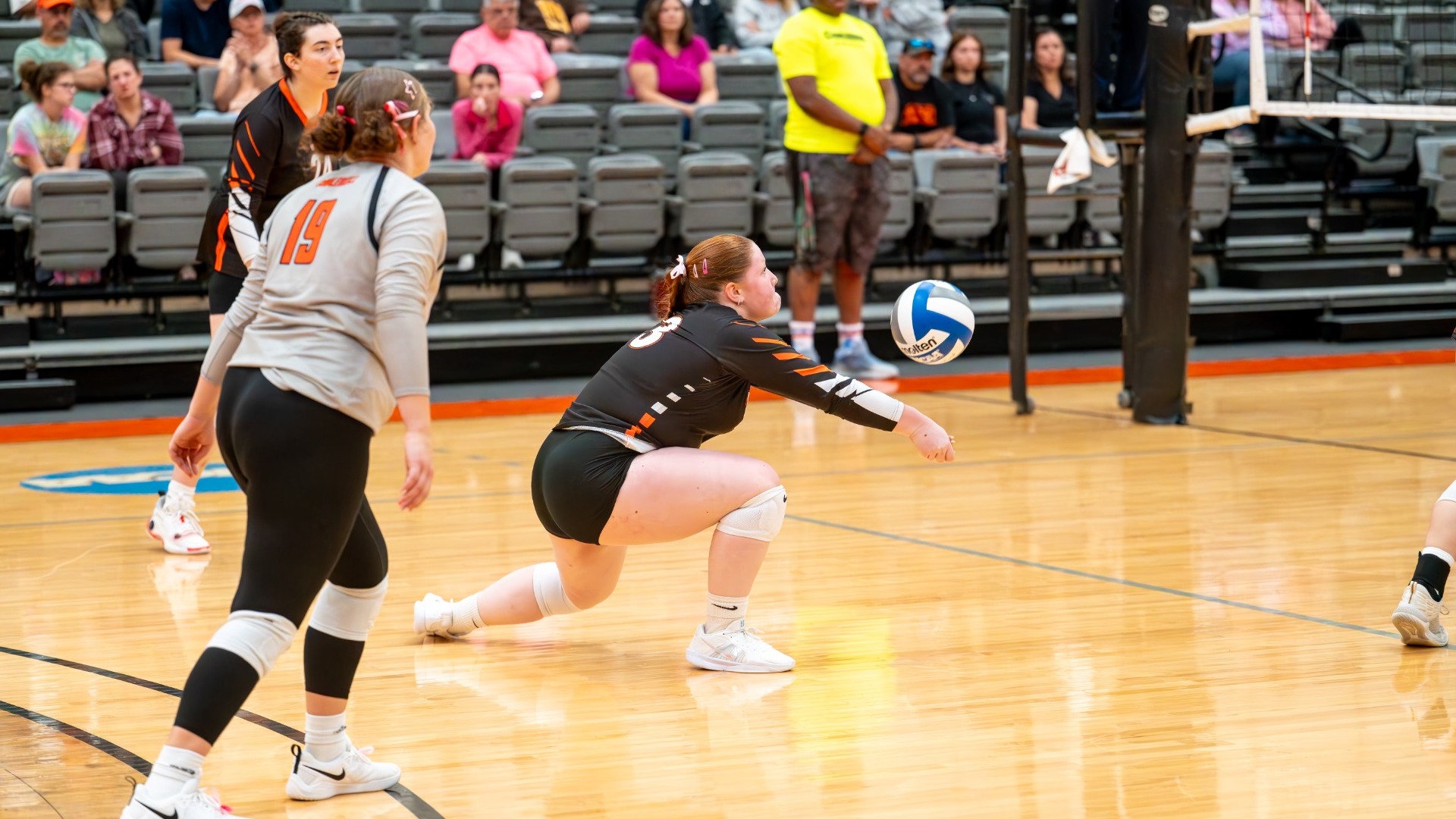 Cobleskill volleyball Tori Harrington hitting the ball near the ground