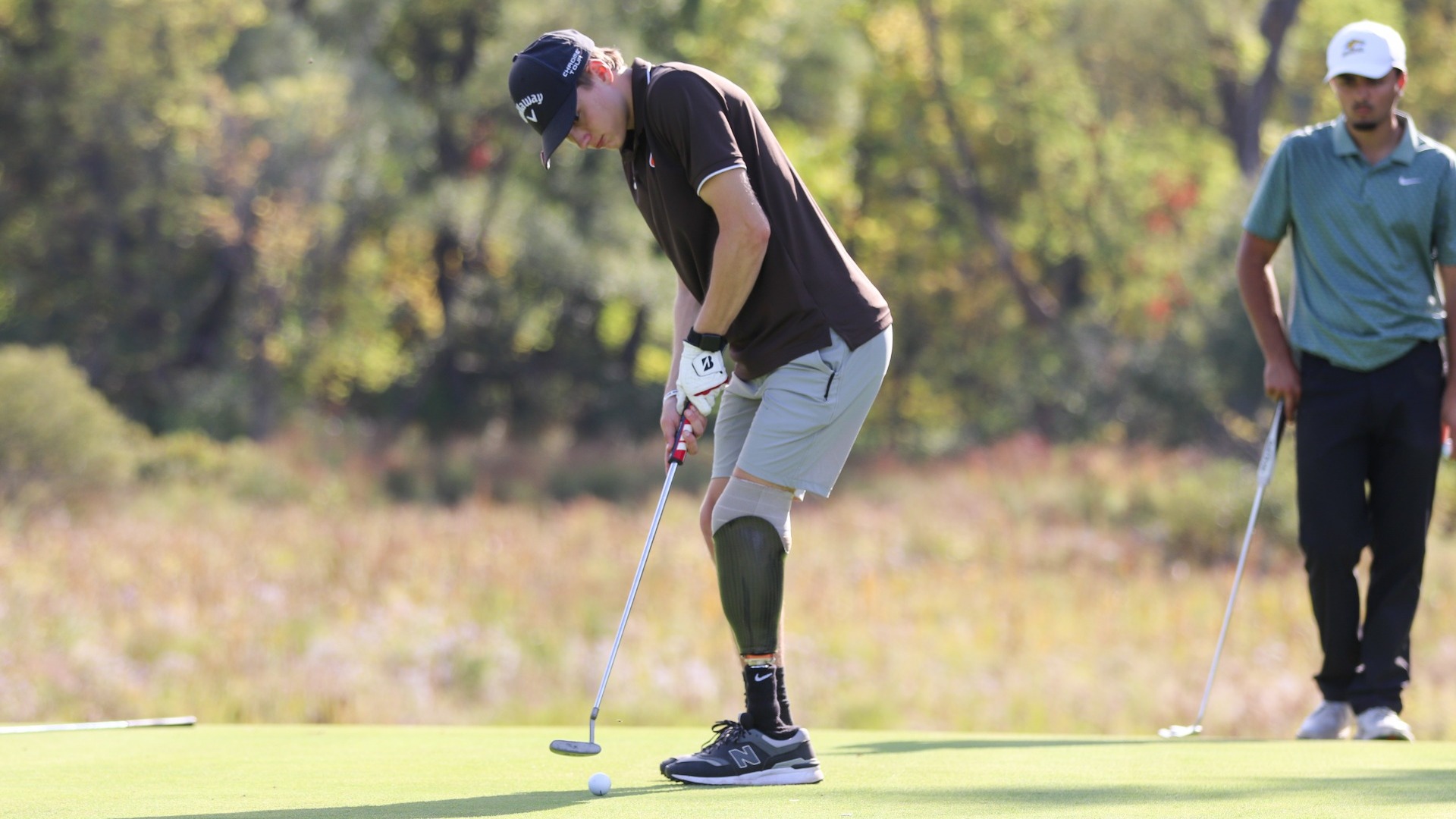 Cobleskill mens golfer Joey Olbrich putting on the green