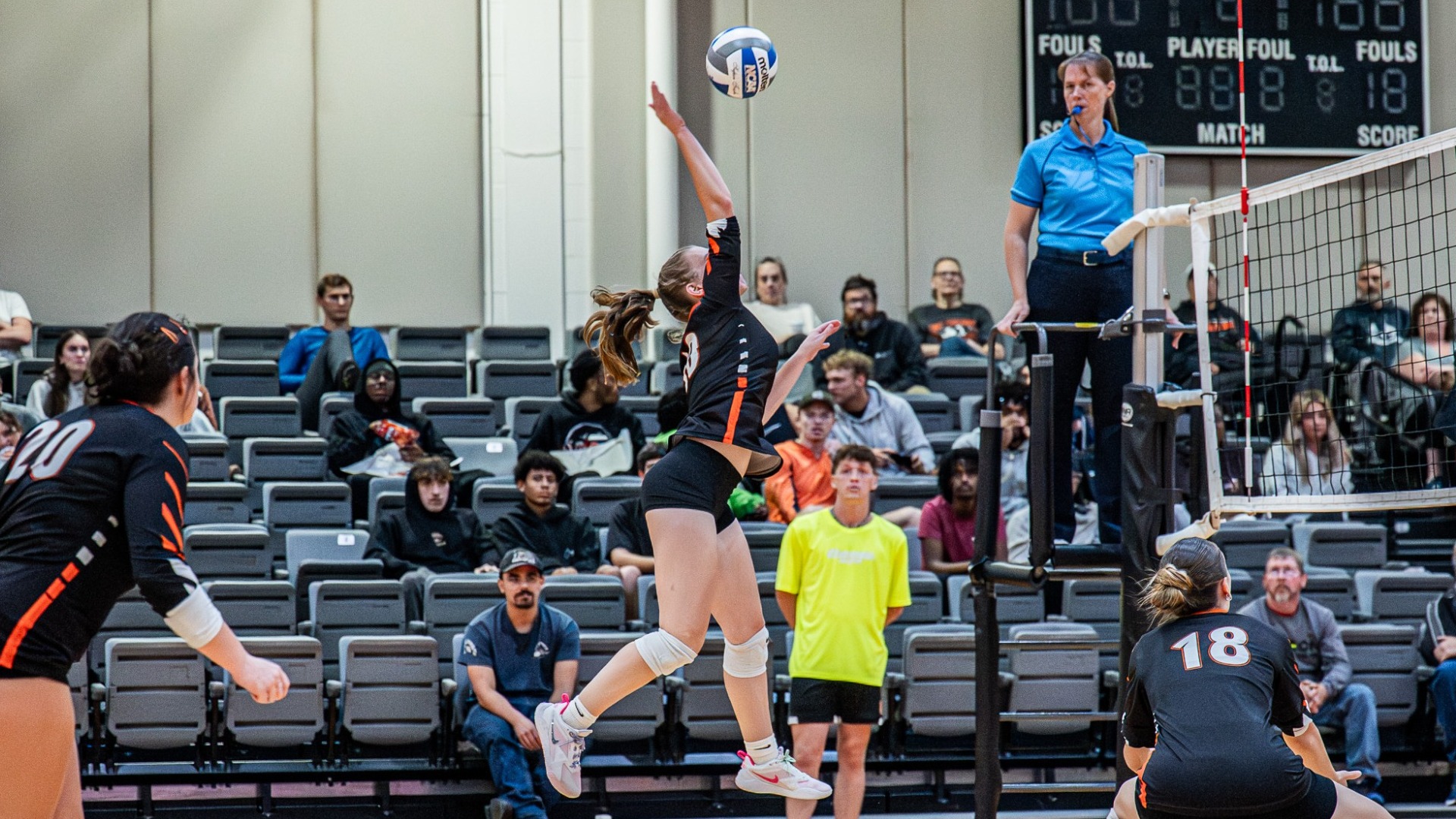 Cobleskill women's volleyball player Kathleen Smart spiking the ball against Russell Sage