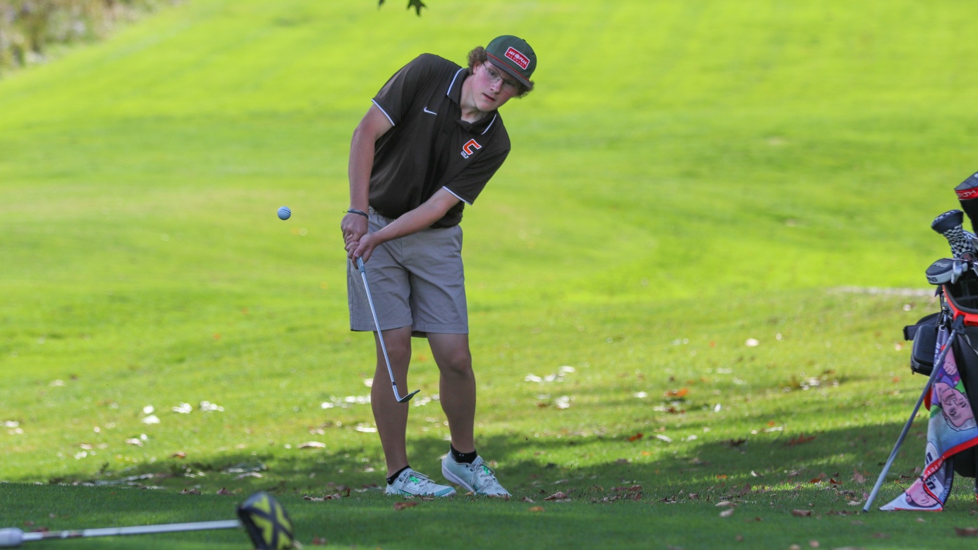 Cobleskill mens golf Bruno Groth chipping on to the green at Cobleskill hole 16