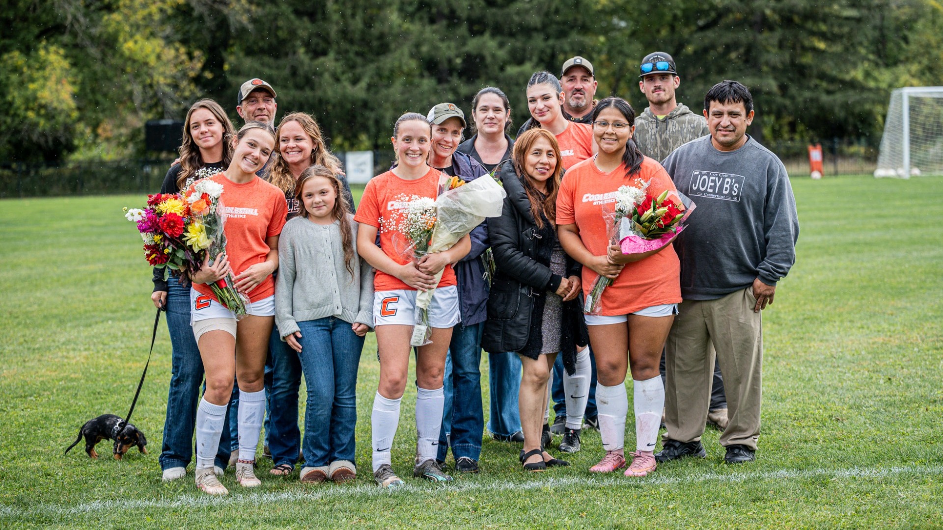 Cobleskill womens soccer seniors with their families before the game 