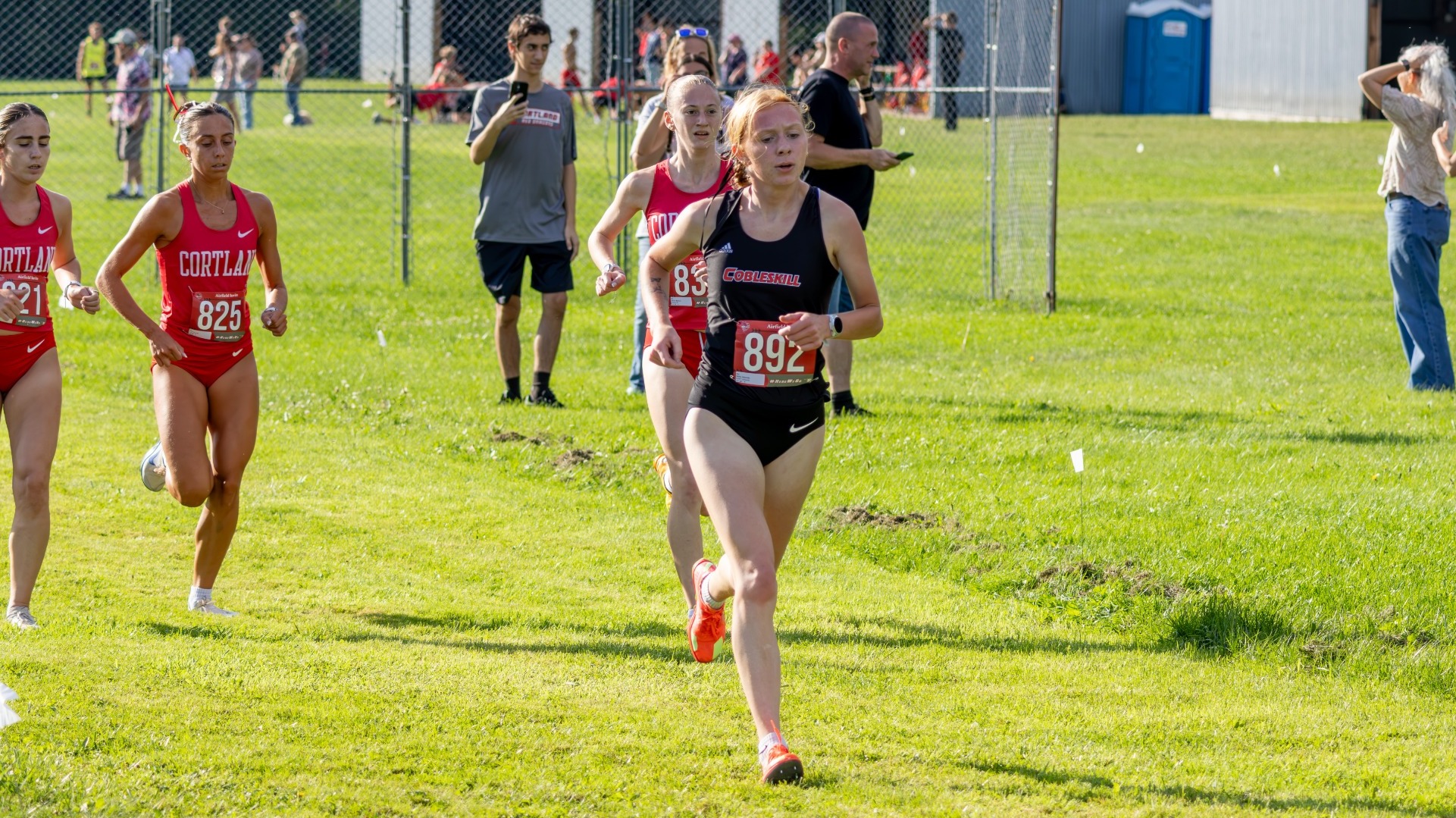 Photo Shows Gabrielle Waite of Women's Cross Country Running at the Oneonta Airfield Invitational