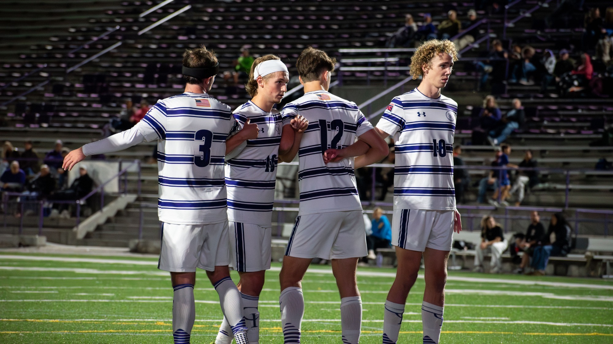 Yotes Men soccer forming a wall