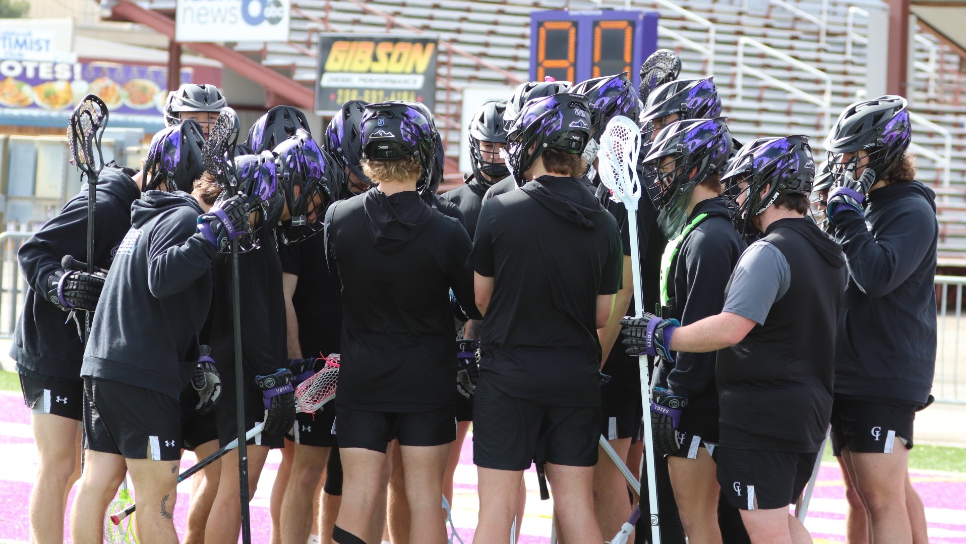 Yote lax in a huddle