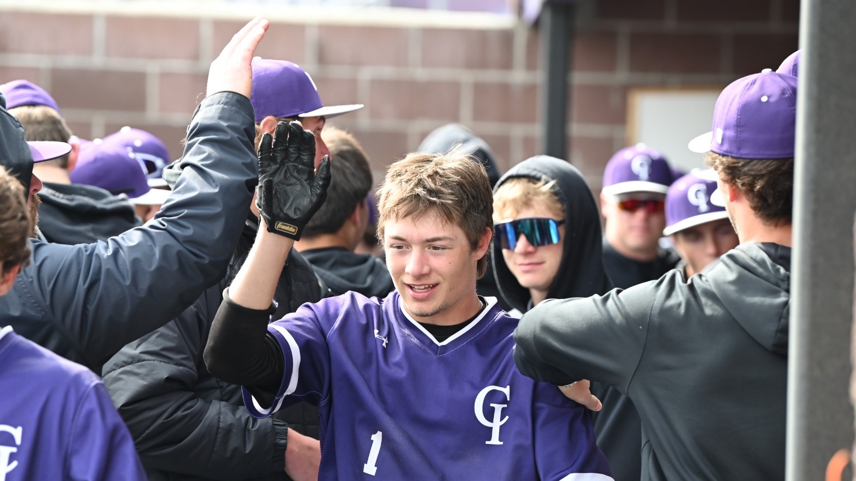 Yotes in the dugout celebrating