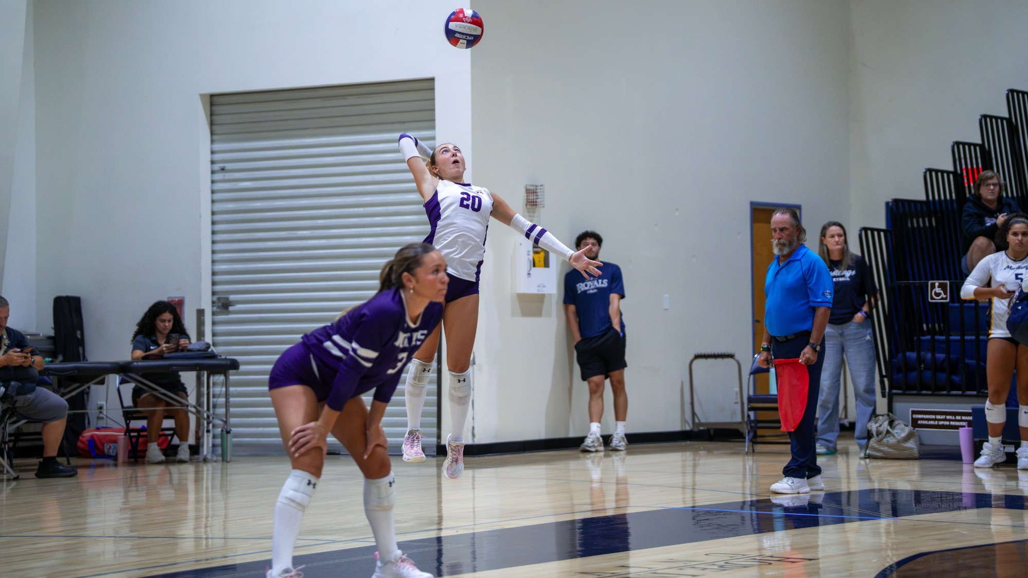 Avery Lewis serves an ace