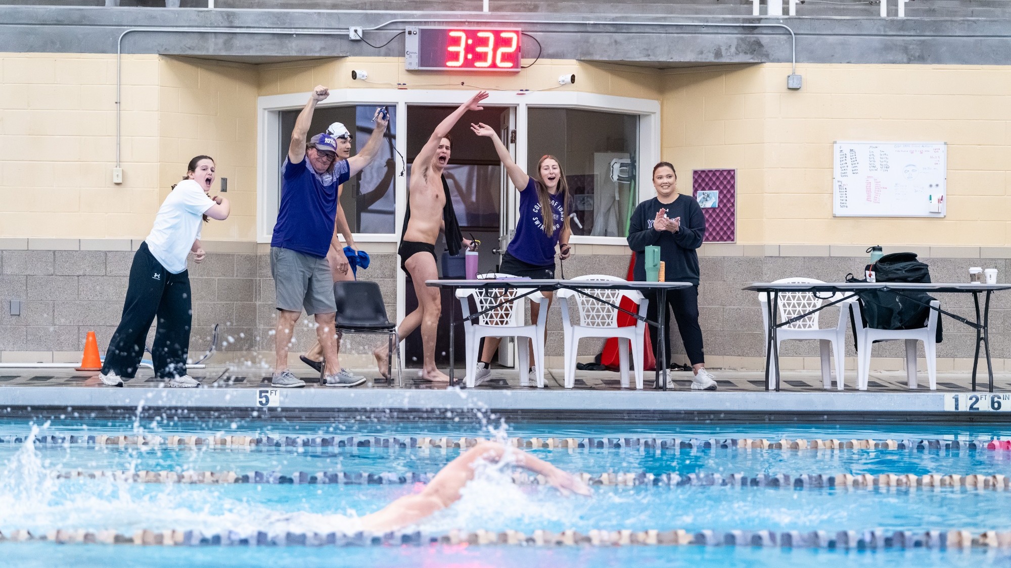 Yotes cheering on Yote Swimmer