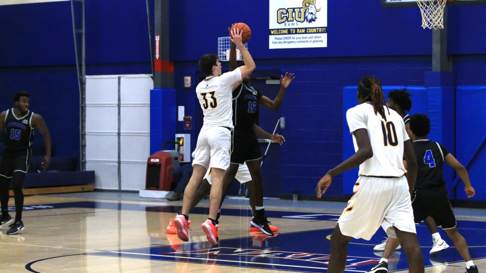 Johnny Whysong drops in a floater ove the SMC defense 