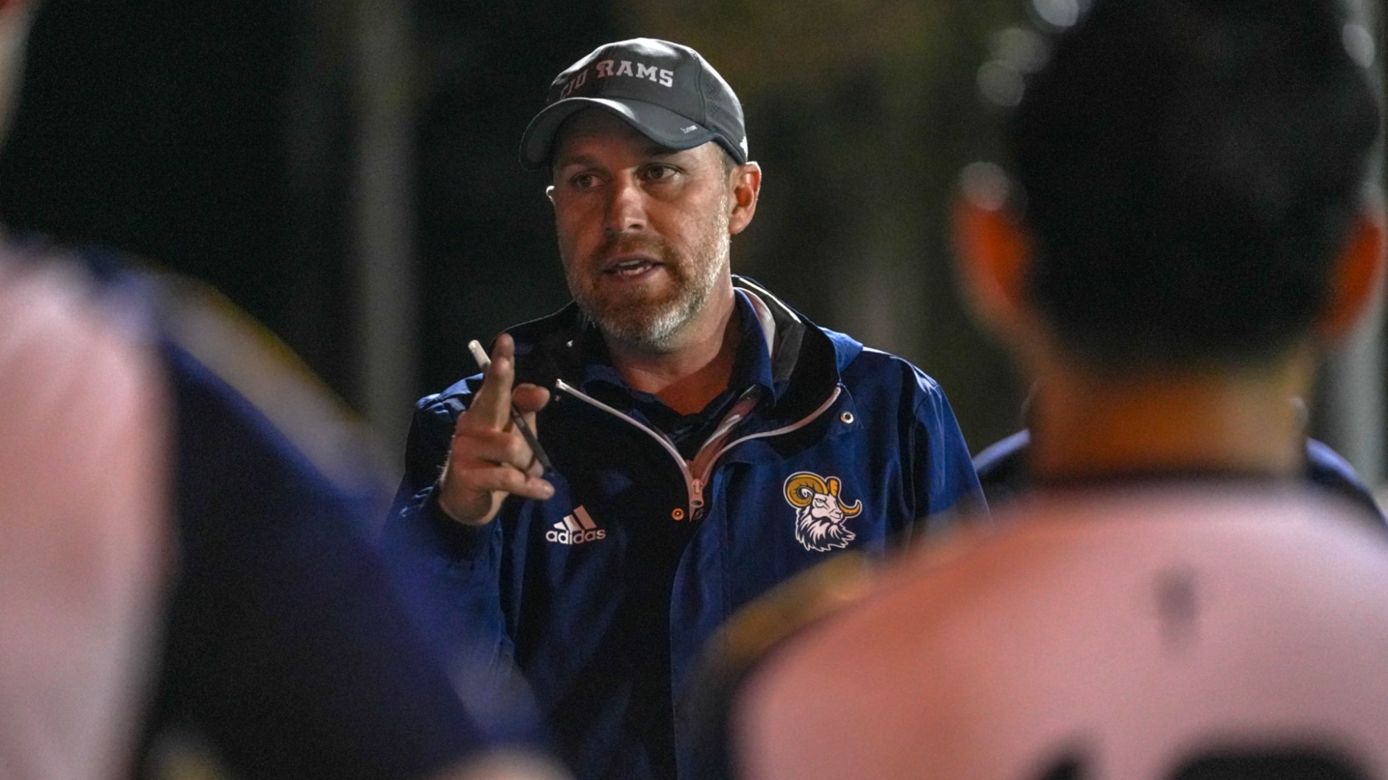 Bill Brindley talks to his team