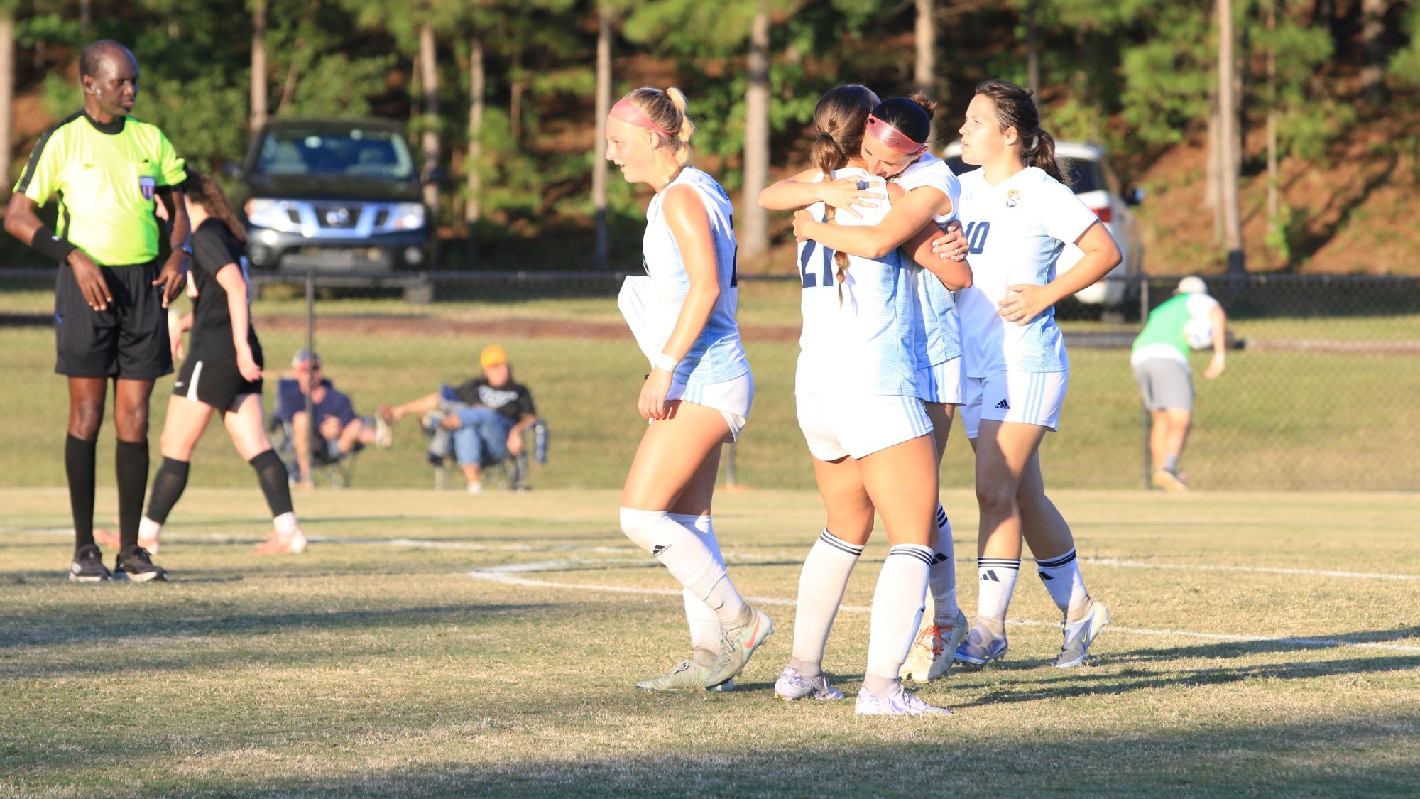 Women's Soccer celebrates a goal.