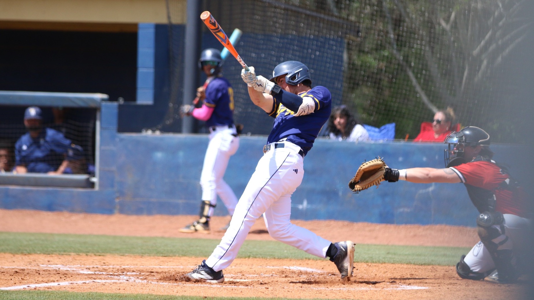 Kai Smith follows through a swing at the plate 