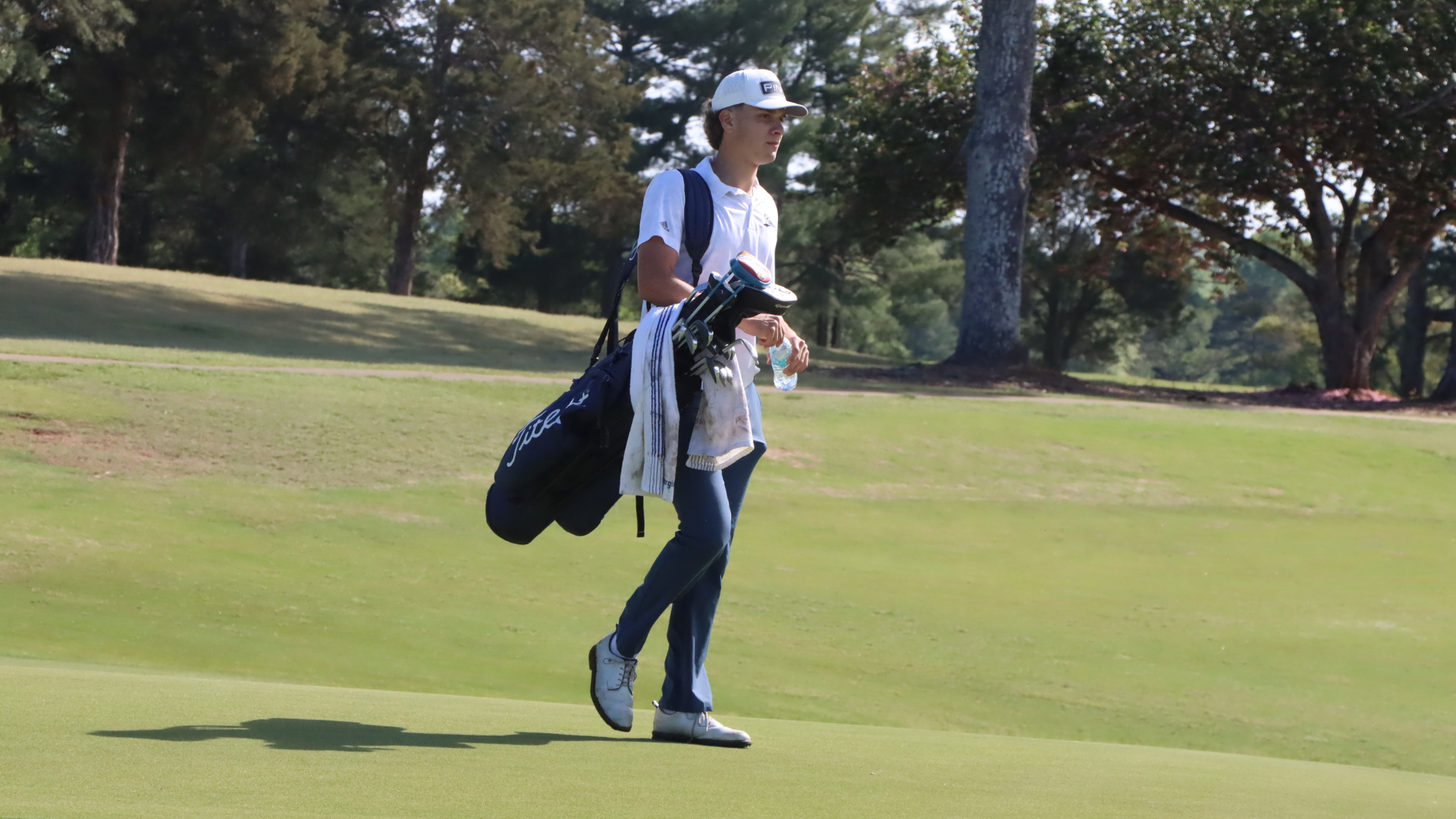 Santos Espinosa strides across the green for CIU Golf