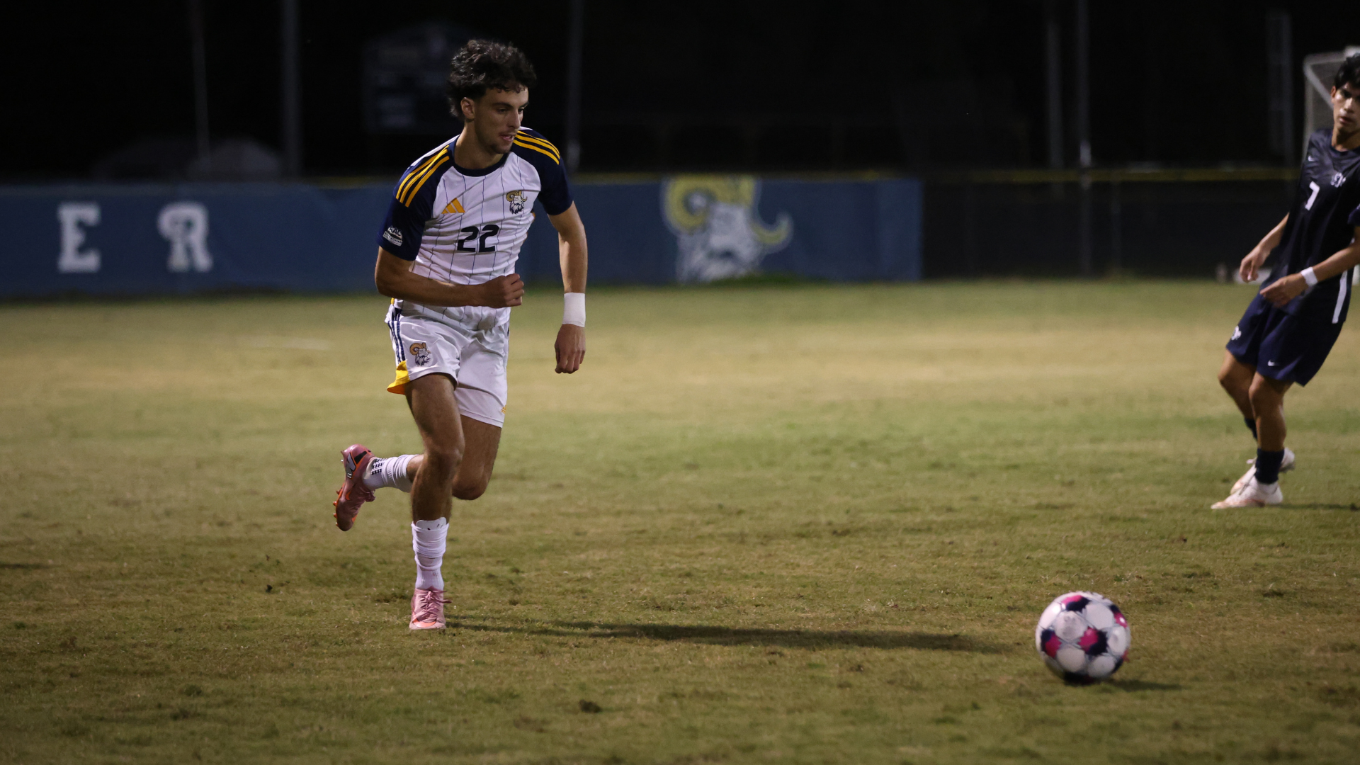 Tuerner Furgeson dribbles the ball up feild 
