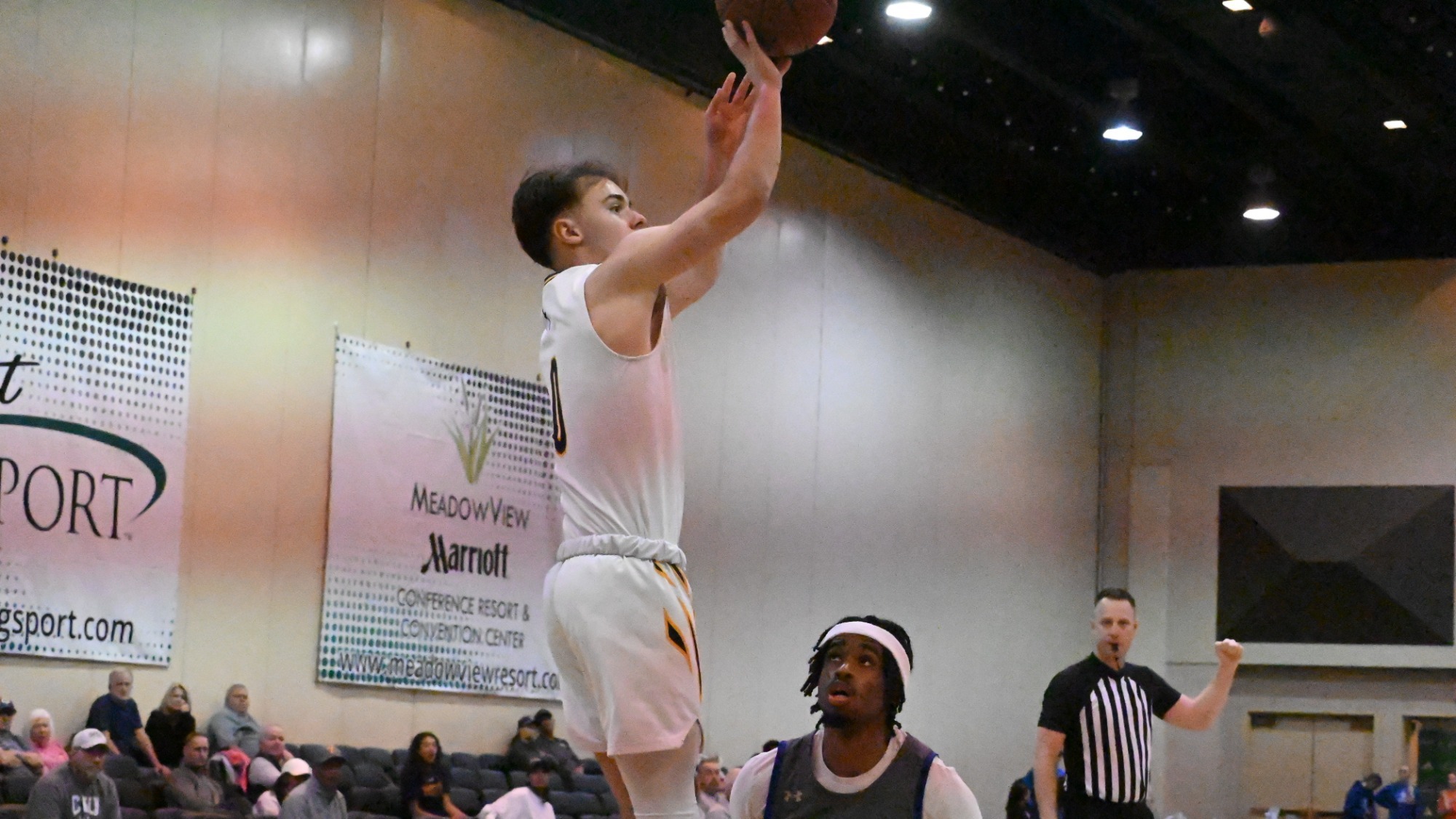JJ Vaughan shoots a three in the AAC quarterfinal 
