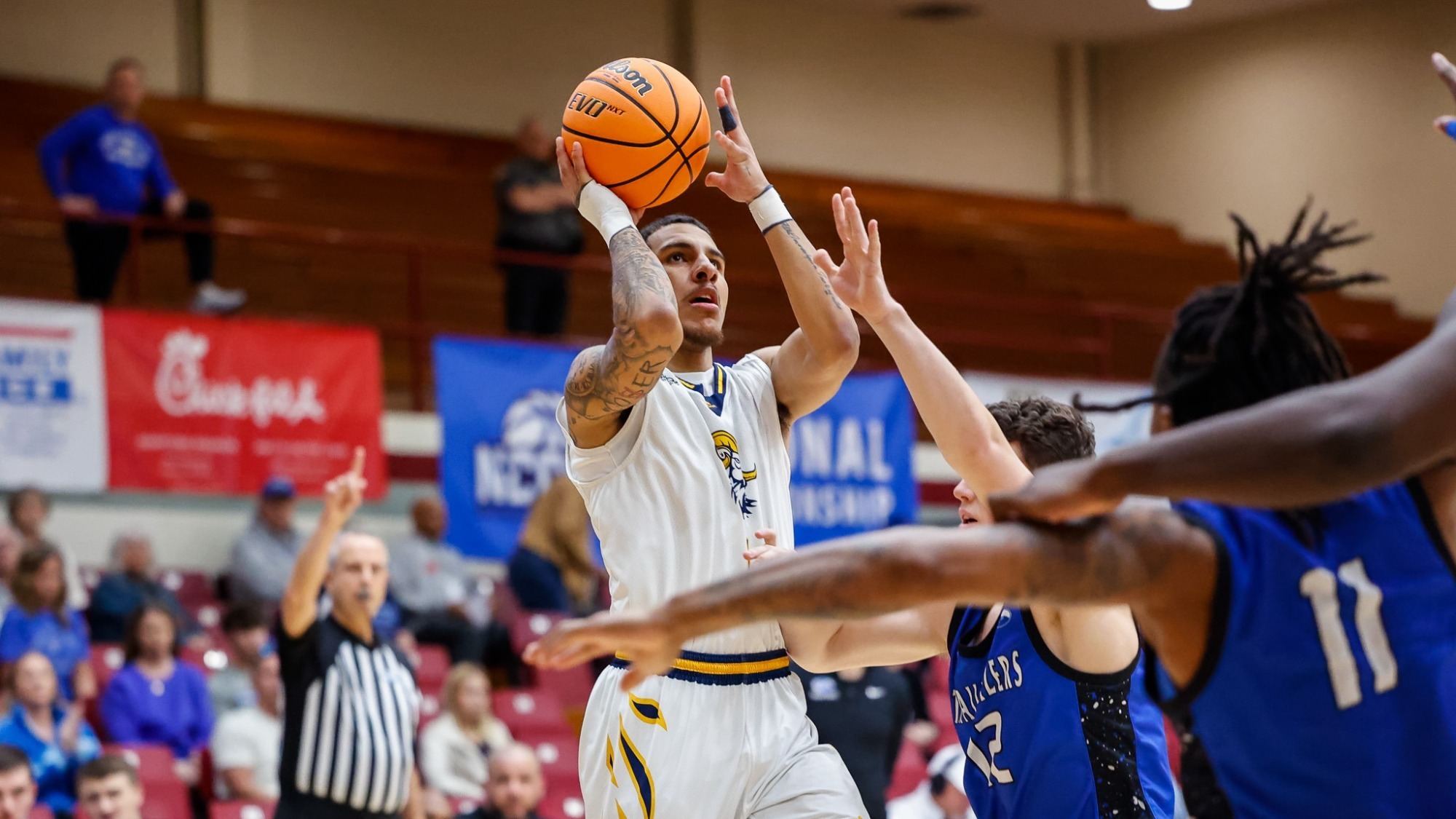 Will Kelly shoots over a OCU defender 
