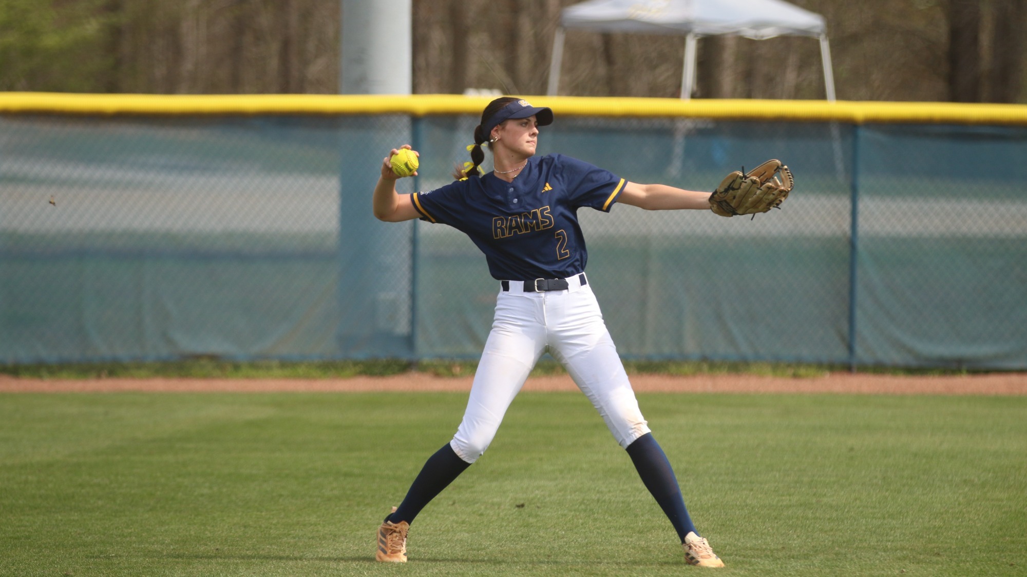 Raleigh Stewart throws a ball in from left field 