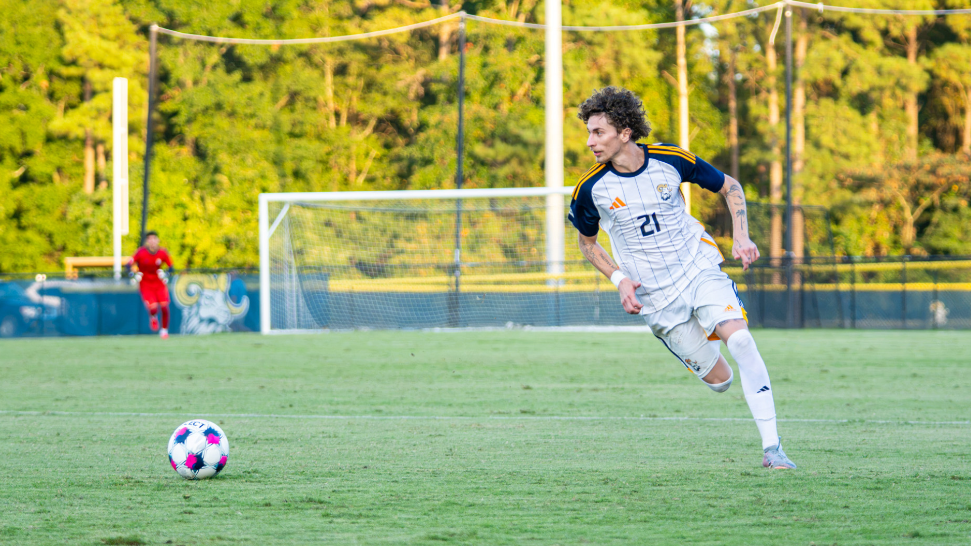 Andreas Kostas dribbles for CIU soccer