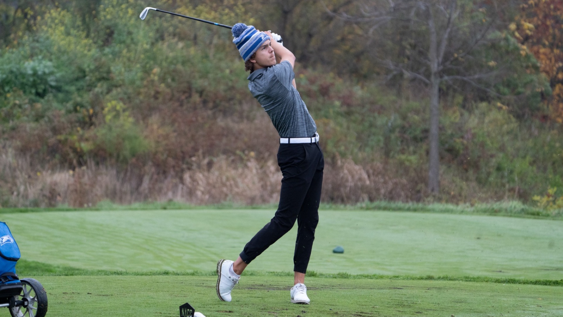 Dylan Smith completing a tee shot.