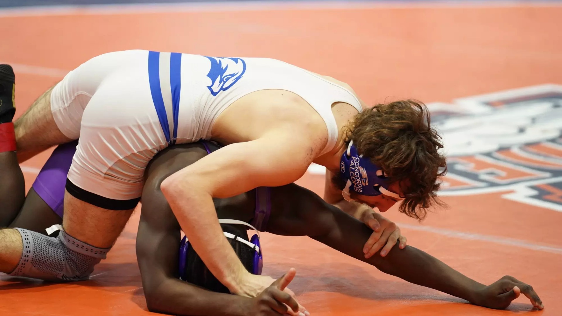 Anastacio Martinez trying to pin an opponent on the mat. 