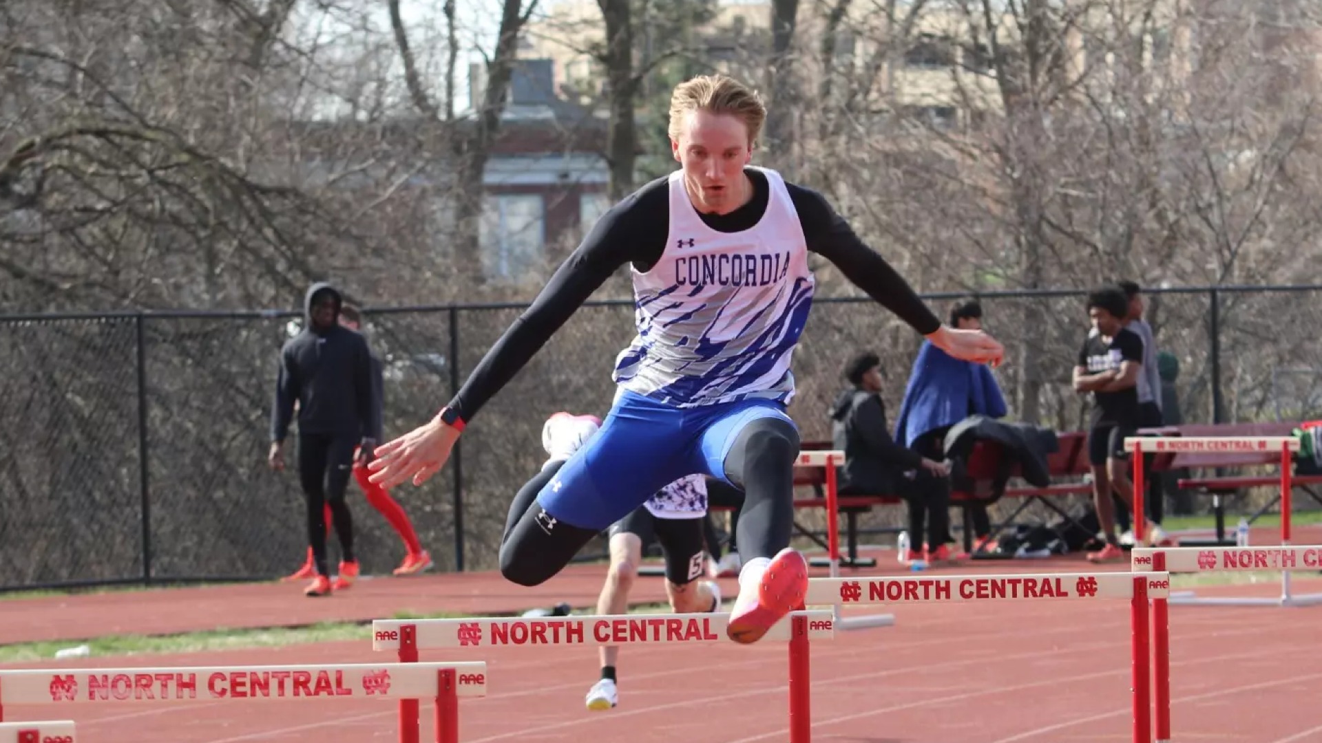 Zach Wendland competing in the hurdles. 