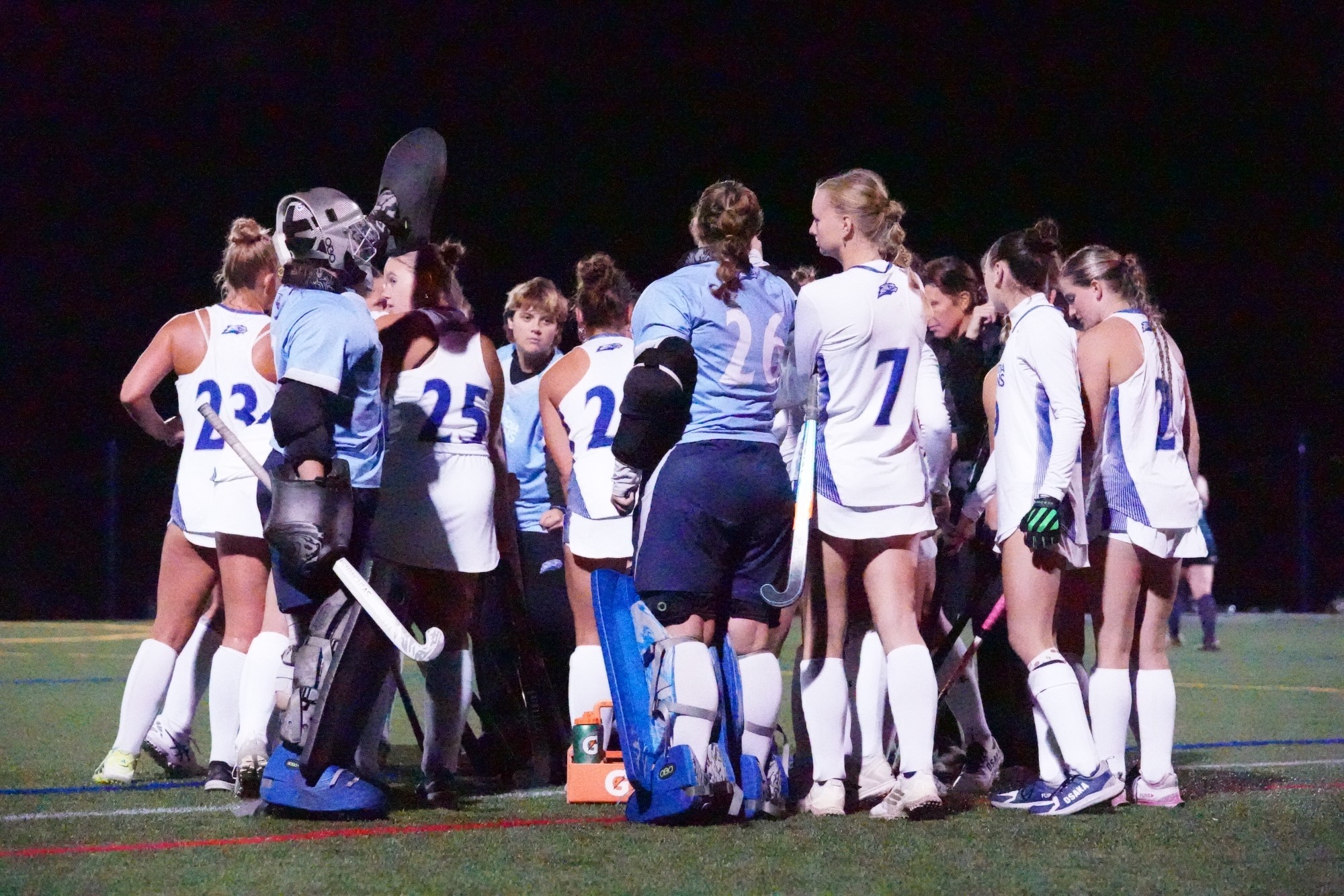 field hockey team huddle