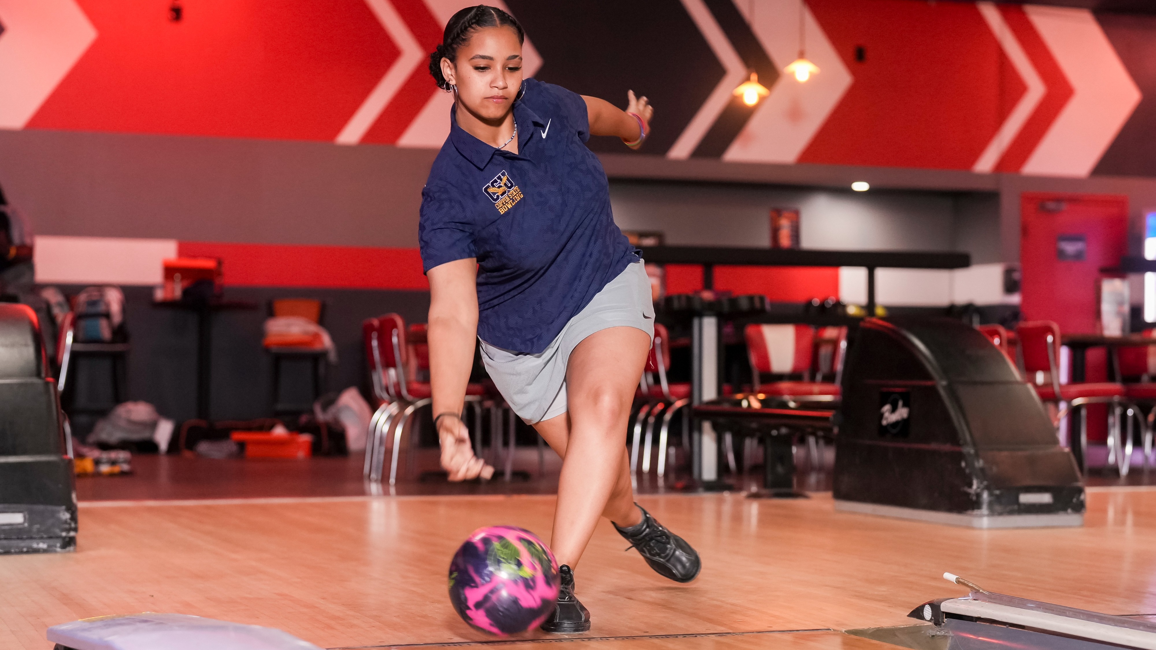 Lawrence bowls down the lane