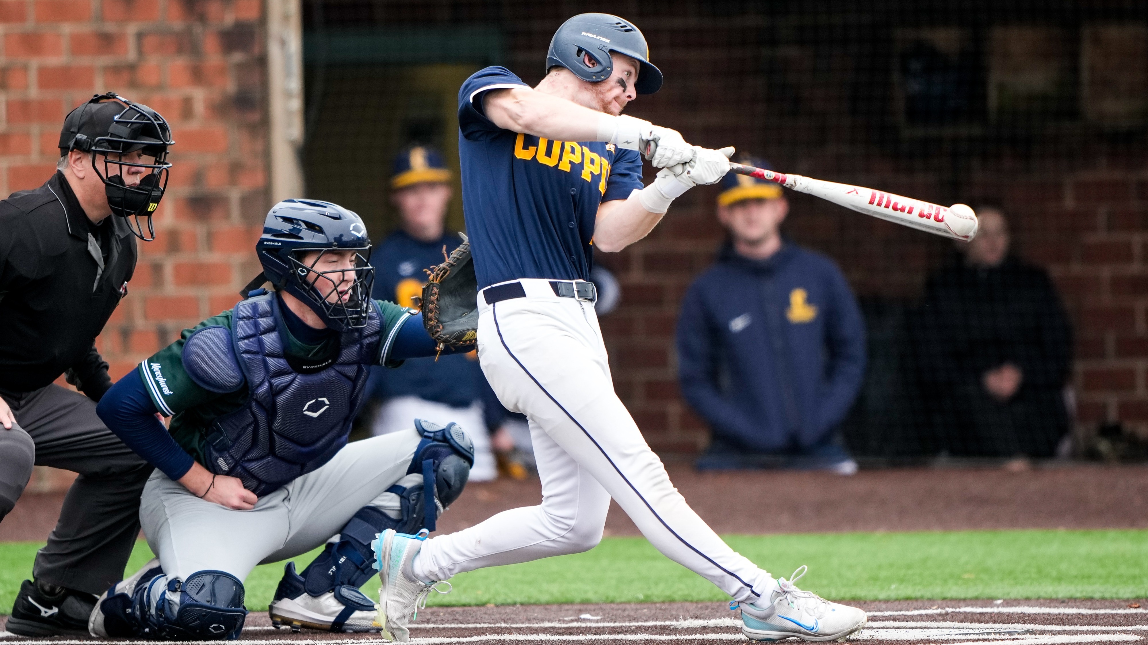 Hogan drives ball for hit vs Mercyhurst