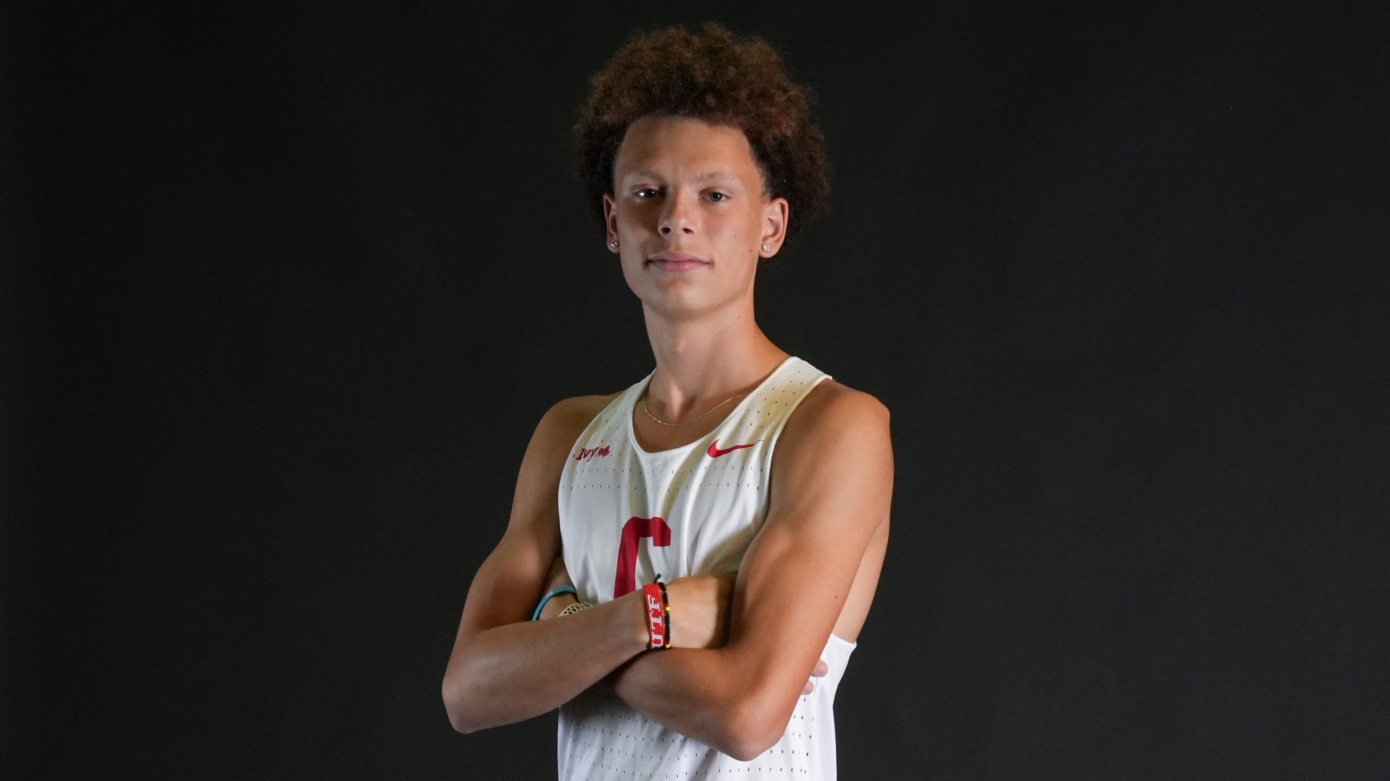 Pierre Attiogbe poses with his arms crossed at 2023 media day.