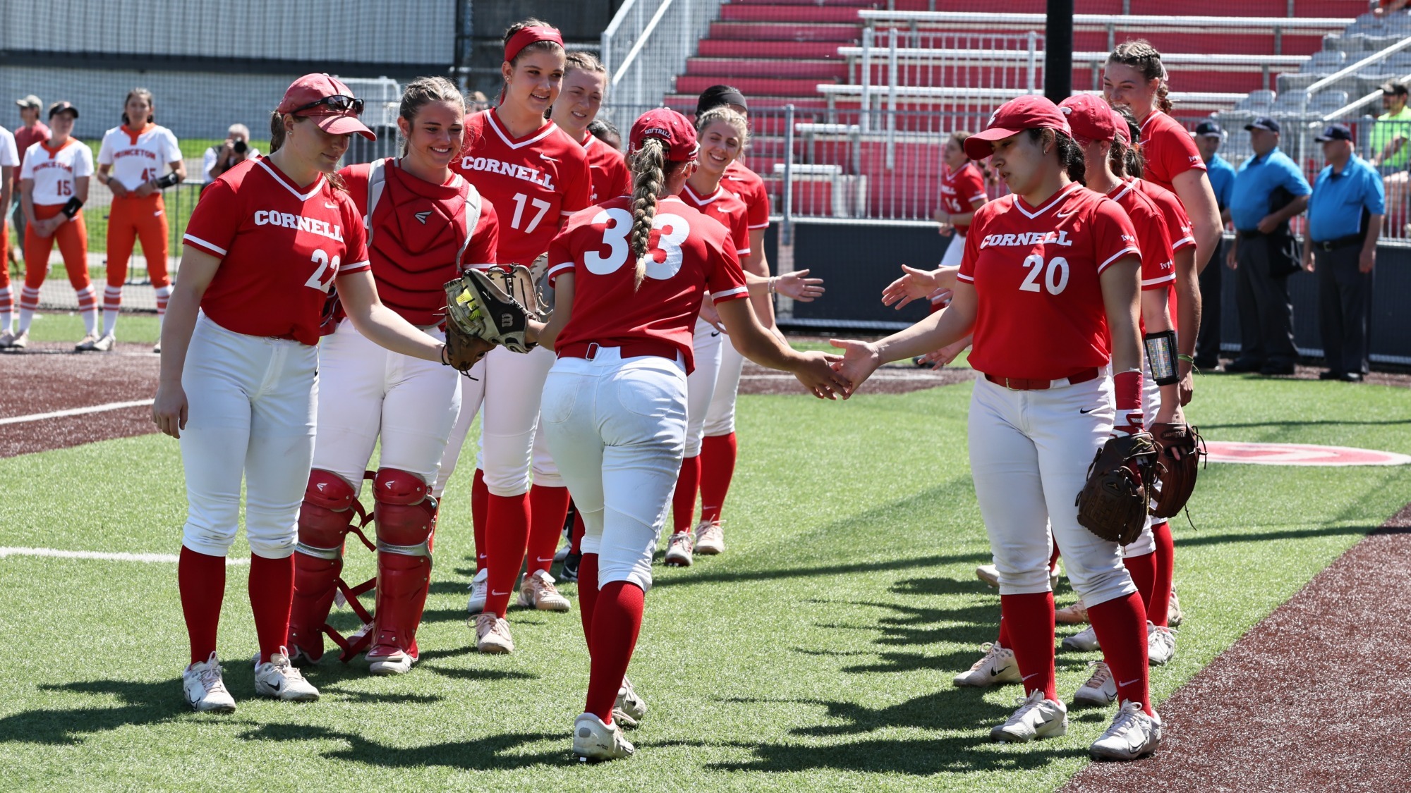 Sydney Stapf runs through the Cornell handshake line during her pregame introduction at Niemand-Robison Field.