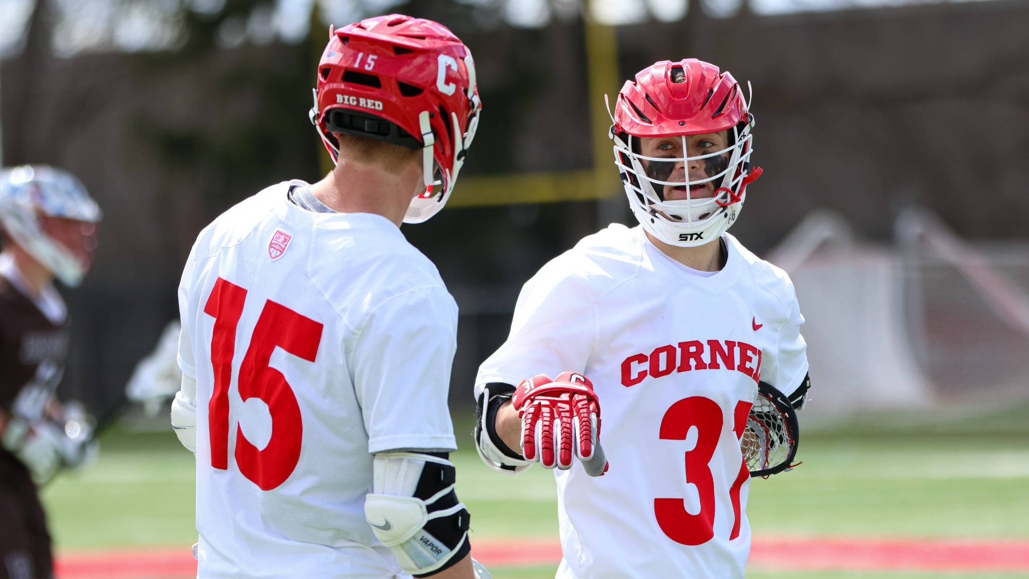 Spencer Wirtheim and CJ Kirst chat on the field against Brown.