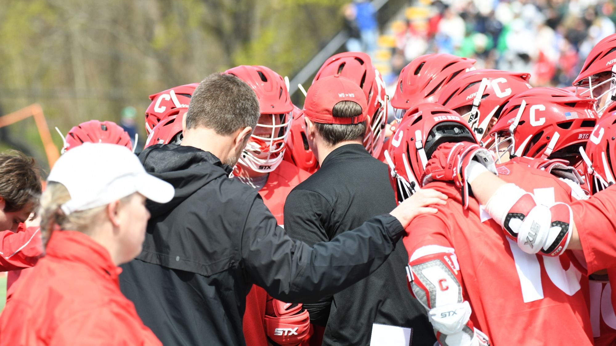 Coach Buczek huddles with the team against Notre Dame.