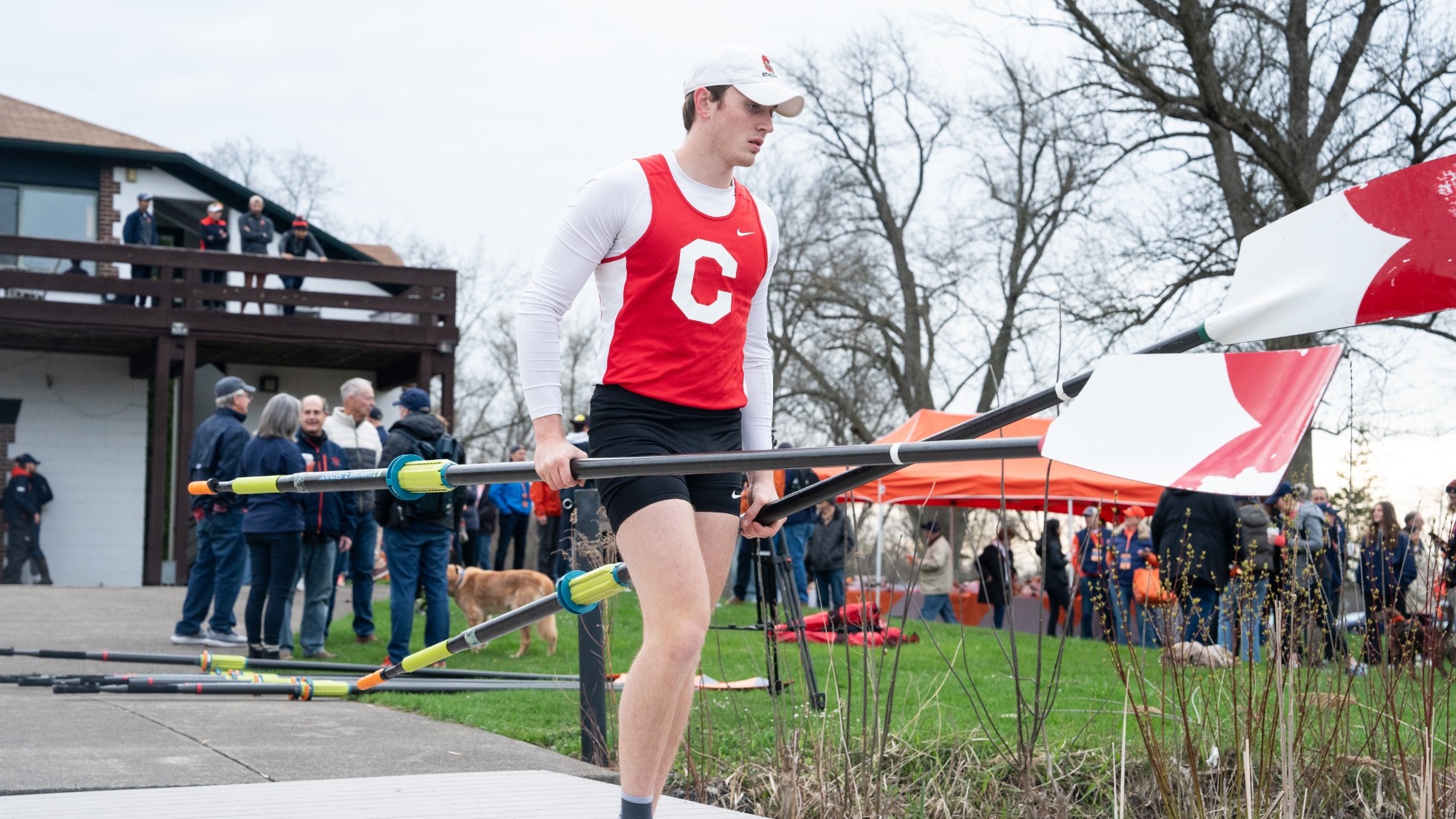 A photo of Abe Litvak carrying oars prior to the Goes Trophy on April 20, 2024, in Syracuse, N.Y.